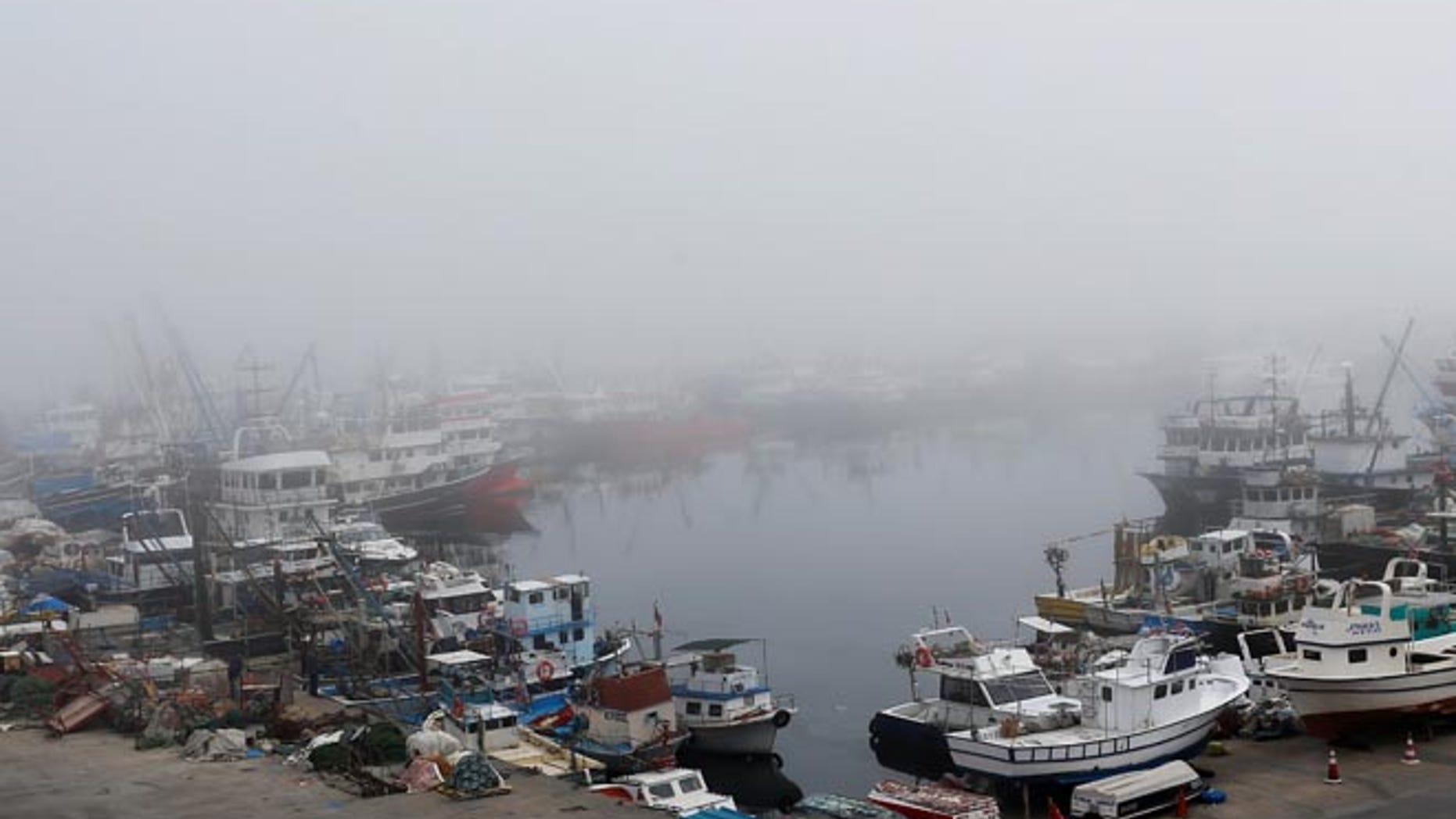 Boats seen in the fog-covered Rumelifeneri village port at the Black Sea on Thursday, the same day a Russian ship sank off the coast.