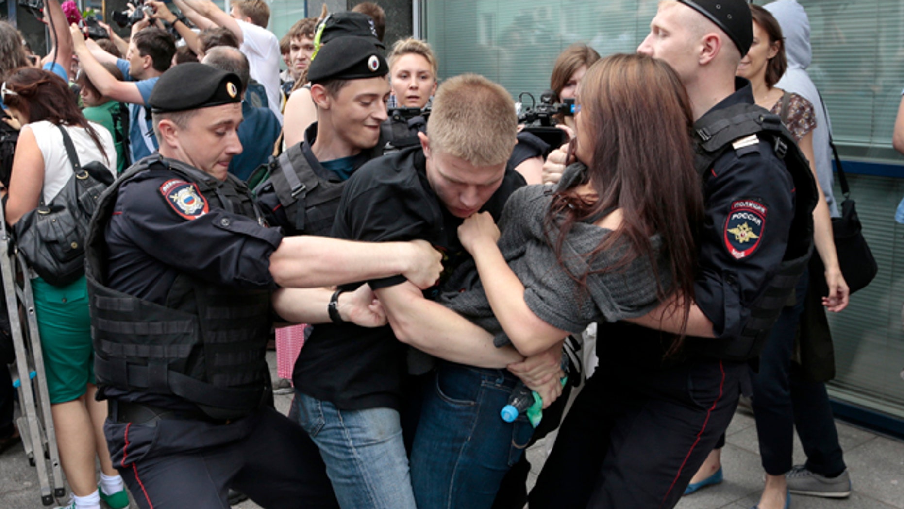June 11, 2013: Police officers detain gay rights activists as they gathered near the State Duma, Russia's lower parliament chamber, in Moscow, Russia.