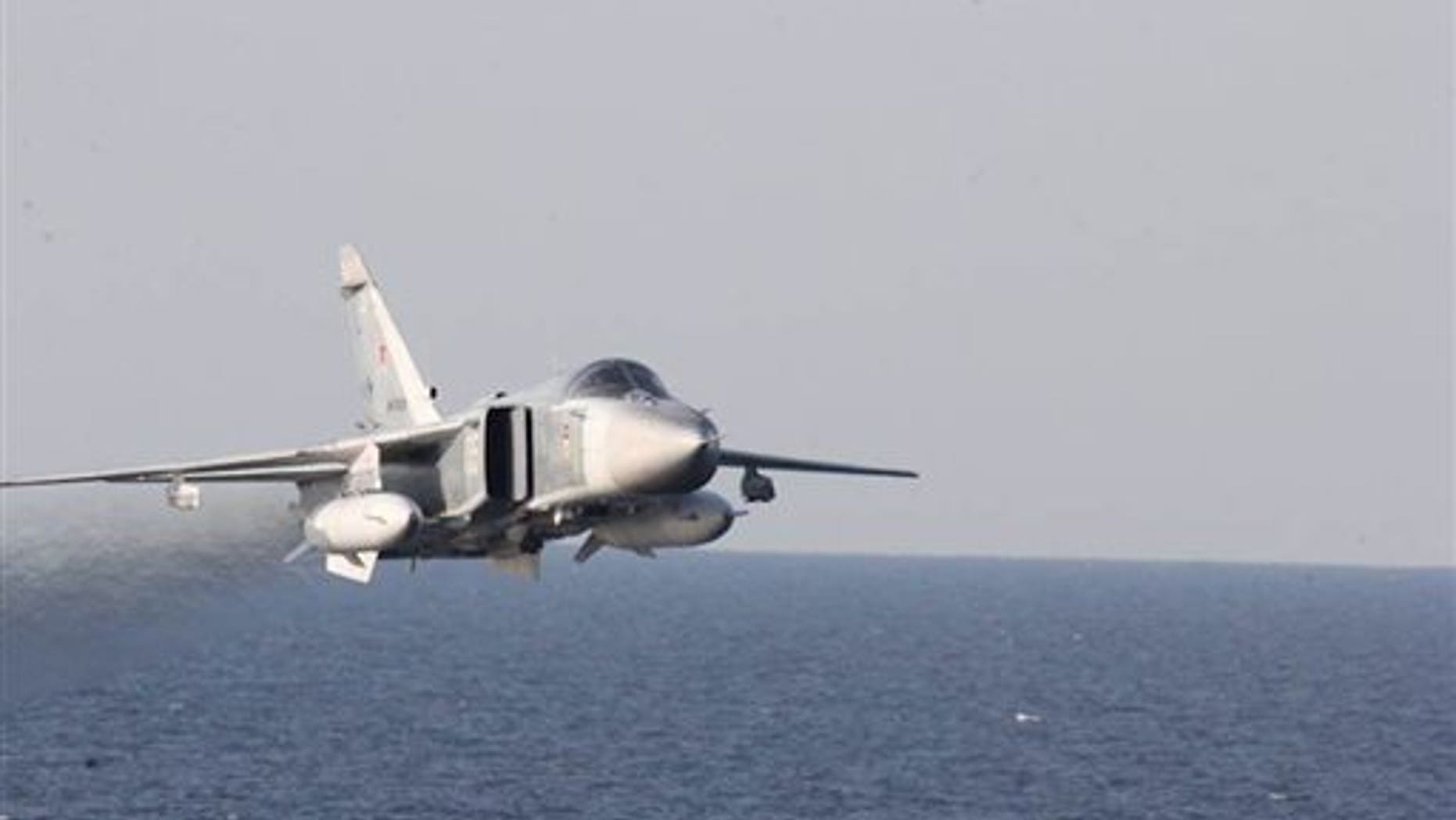 A Russian fighter jet makes a low altitude pass by the USS Donald Cook on April 12.