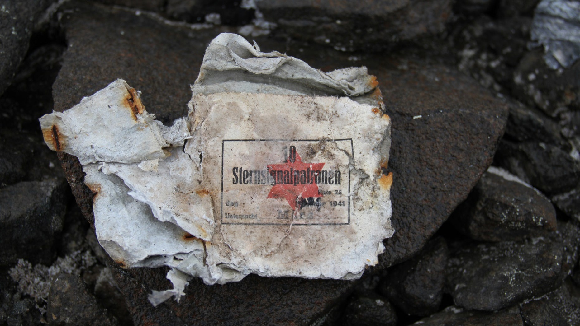 Fragment of signal cartridge box <a href="http://www.foxnews.com/science/2016/11/04/russian-scientists-unearth-remains-secret-nazi-arctic-base.html" target="_blank">found</a> at the site (Yulia Petrova).