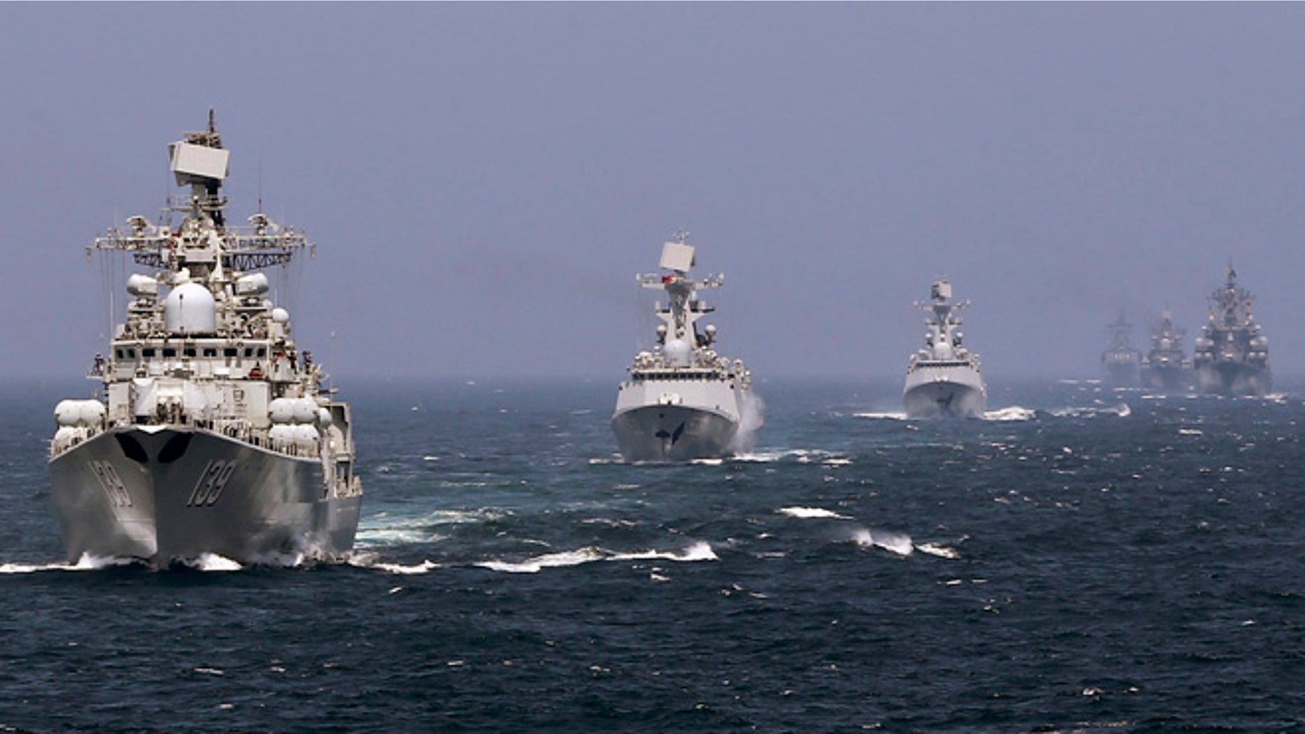 May 24, 2014:Chinese and Russian naval vessels participate in the Joint Sea-2014 naval drill outside Shanghai on the East China Sea. (Reuters)