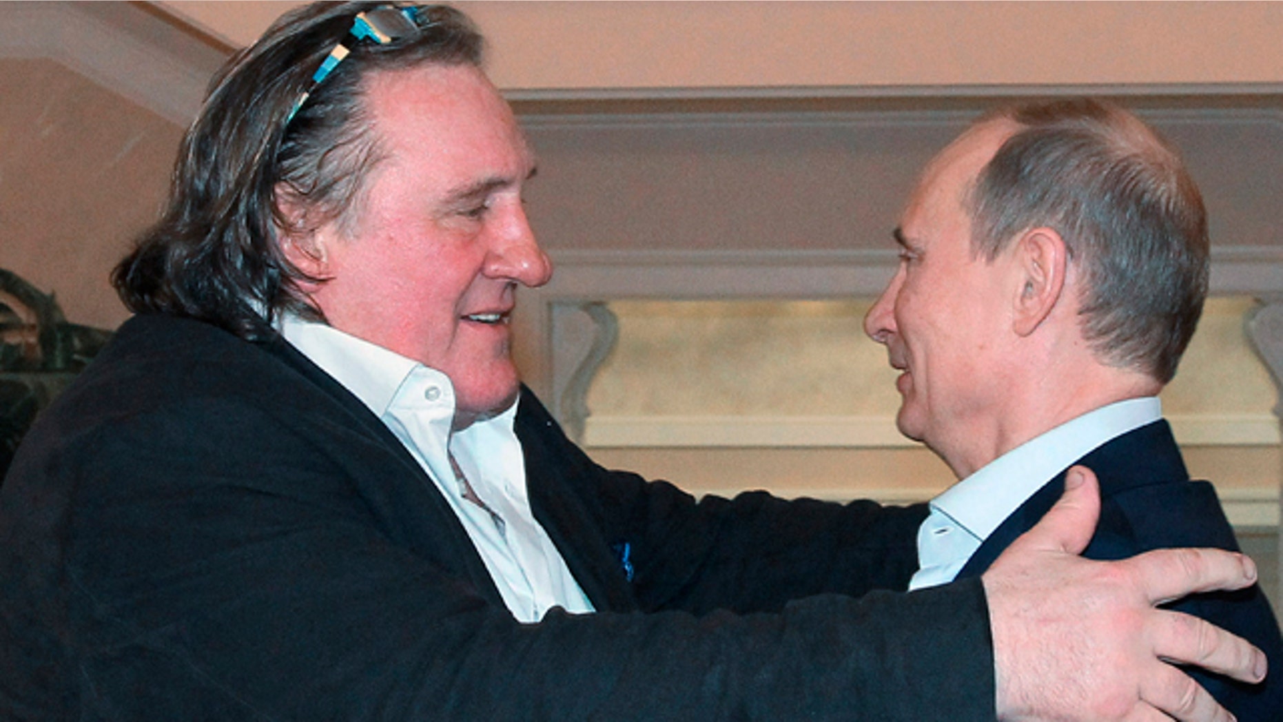 Jan. 5, 2013: French actor Gerard Depardieu, left, greets Russian President Vladimir Putin after his arrival at the president's residence in Sochi.