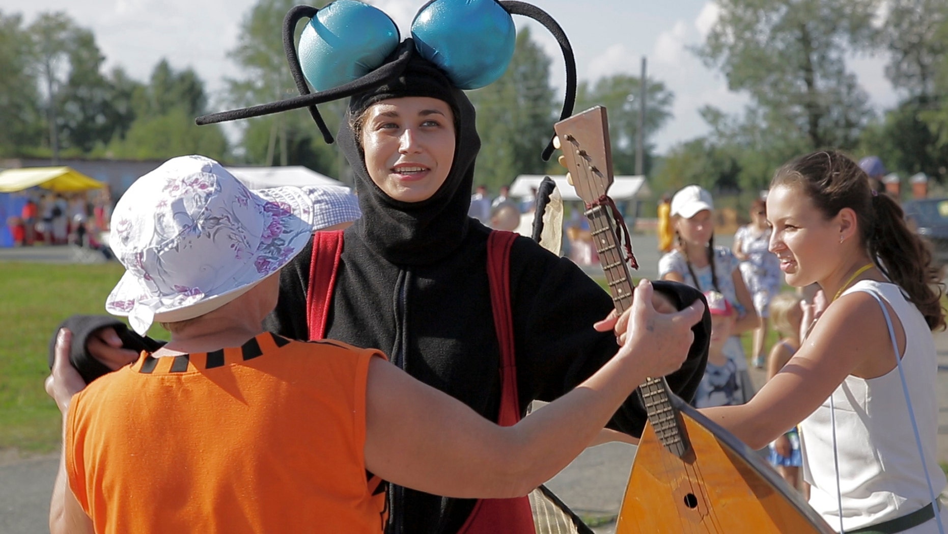 Aug. 14 2016: In this frame grab provided by the APTN a woman dressed as a mosquito enjoyes with others a sunny SUnday during the Russia Mosquito Festival in the town of Berezniki.