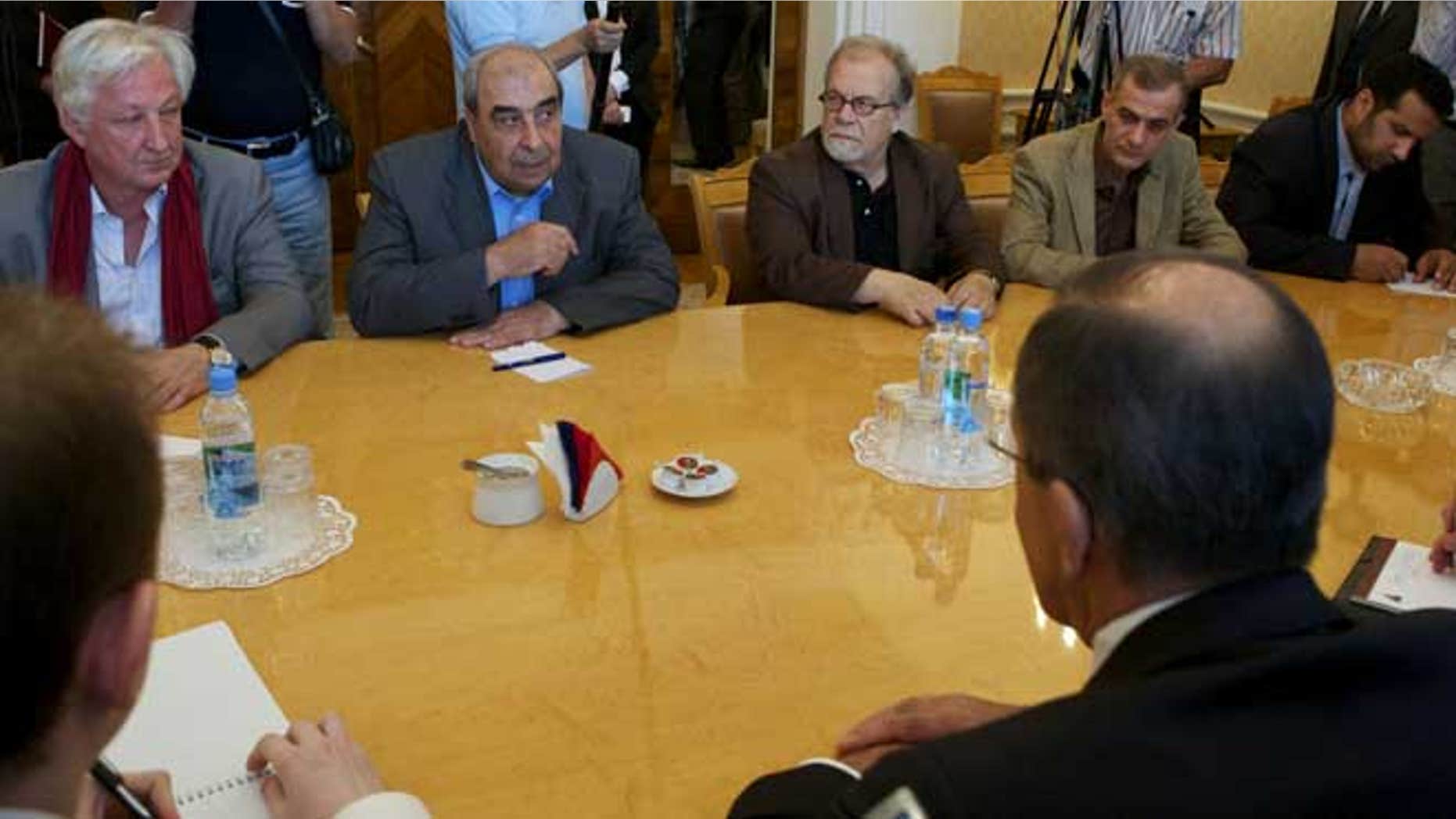 July 9, 2012: Michel Kilo, a Syrian opposition leader and writer, second left, and other unidentified members of a delegation meet with Russian Foreign minister Sergey Lavrov, foreground right, in Moscow, Russia.