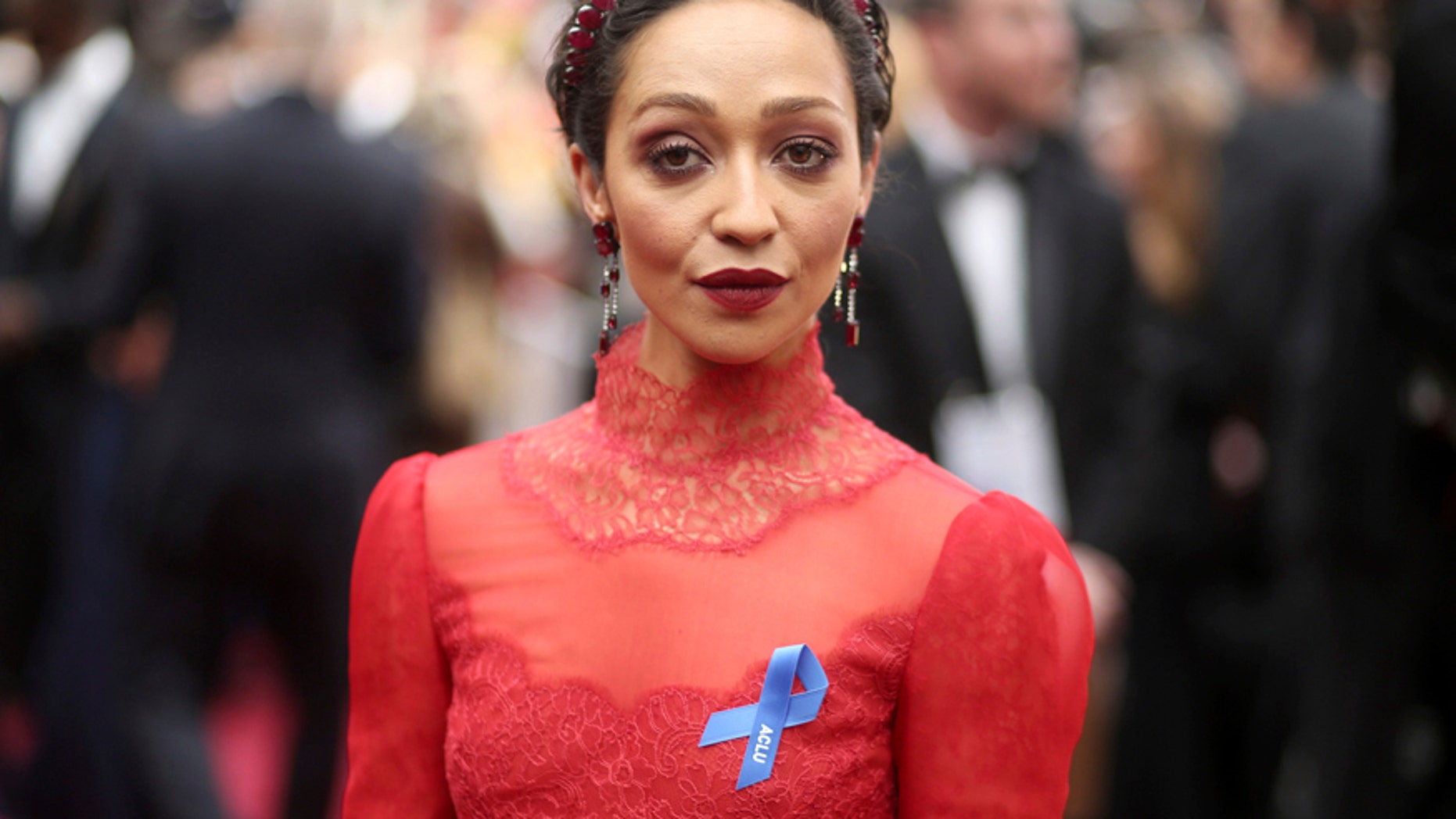 Ruth Negga, wearing the ACLU ribbon, arrives at the Oscars on Sunday, Feb. 26, 2017, at the Dolby Theatre in Los Angeles.