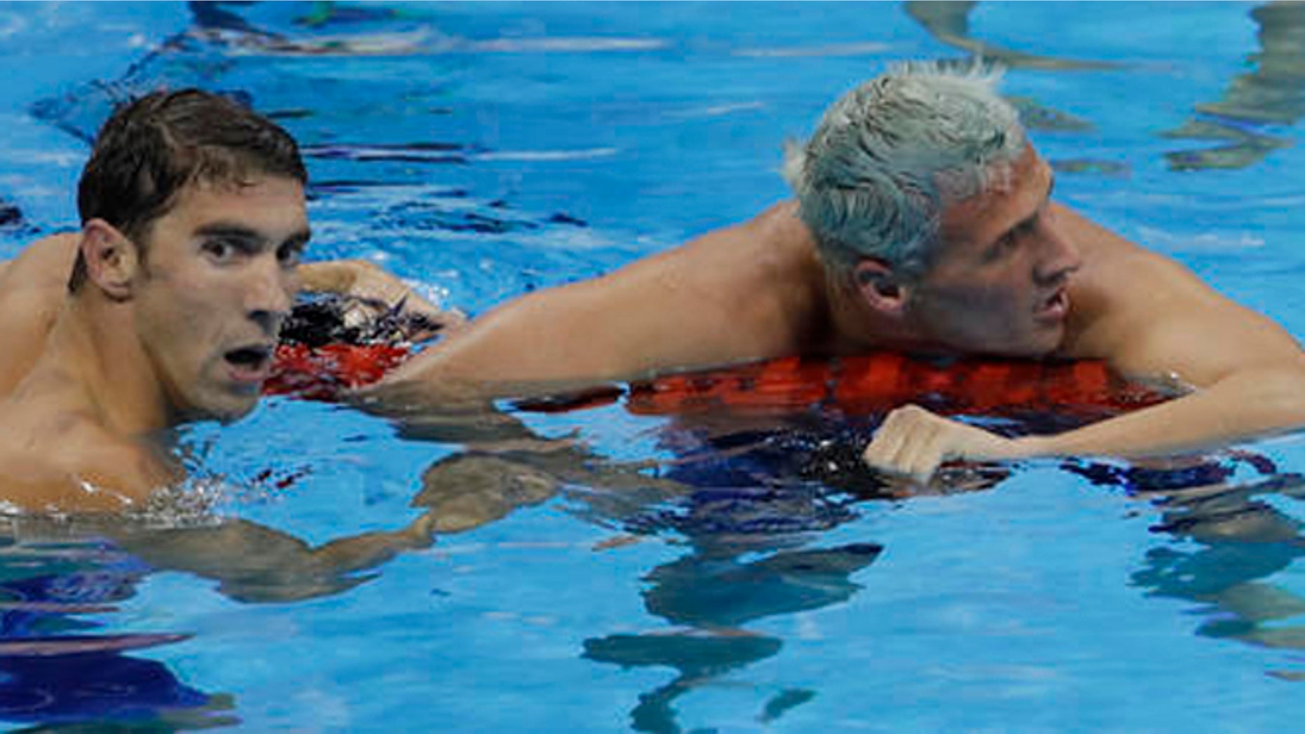 United States' Michael Phelps wins the gold medal in the men's 200-meter individual medley ahead of fifth placed United States' Ryan Lochte, right, during the swimming competitions at the 2016 Summer Olympics, Thursday, Aug. 11, 2016, in Rio de Janeiro, Brazil. (AP Photo/Natacha Pisarenko)