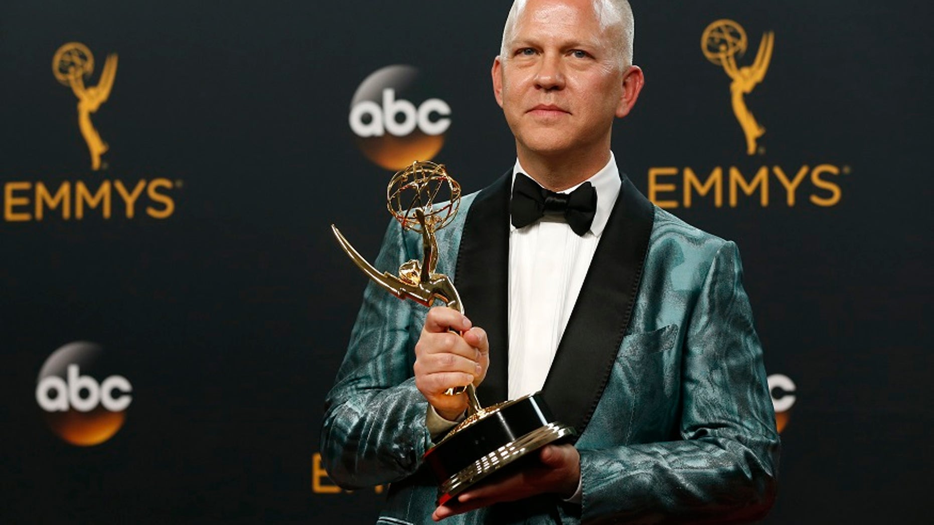 Producer Ryan Murphy poses backstage with the award for Outstanding Limited Series for "The People v. O.J. Simpson: American Crime Story" at the 68th Primetime Emmy Awards in Los Angeles, California U.S., September 18, 2016. REUTERS/Mario Anzuoni - RTSOCPY