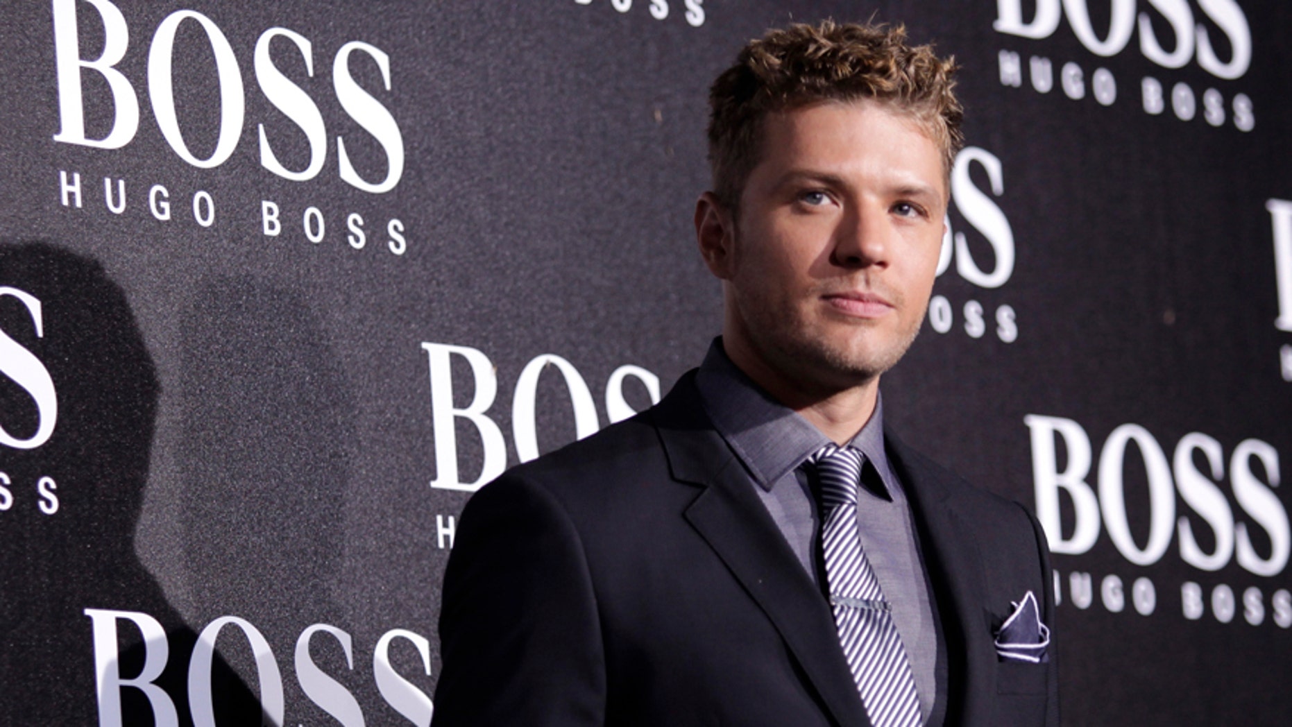 U.S. actor Ryan Phillippe poses ahead of the BOSS Black fall/winter 2012 fashion show by Hugo Boss in Beijing, May 18, 2012. REUTERS/Soo Hoo Zheyang (CHINA - Tags: ENTERTAINMENT FASHION) - RTR3294A