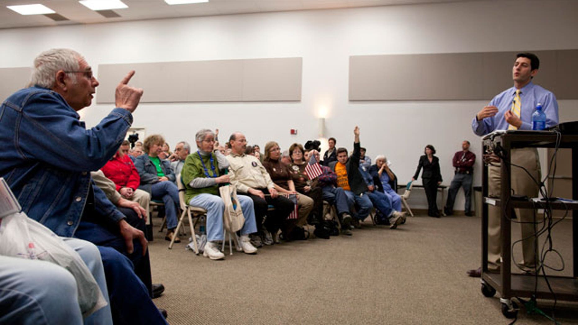A man makes a point to U.S. Rep. Paul Ryan, R-Wis., right, as he speaks during a listening session Tuesday, April, 26, 2011 at Gateway Technical College in Kenosha, Wis. (AP)