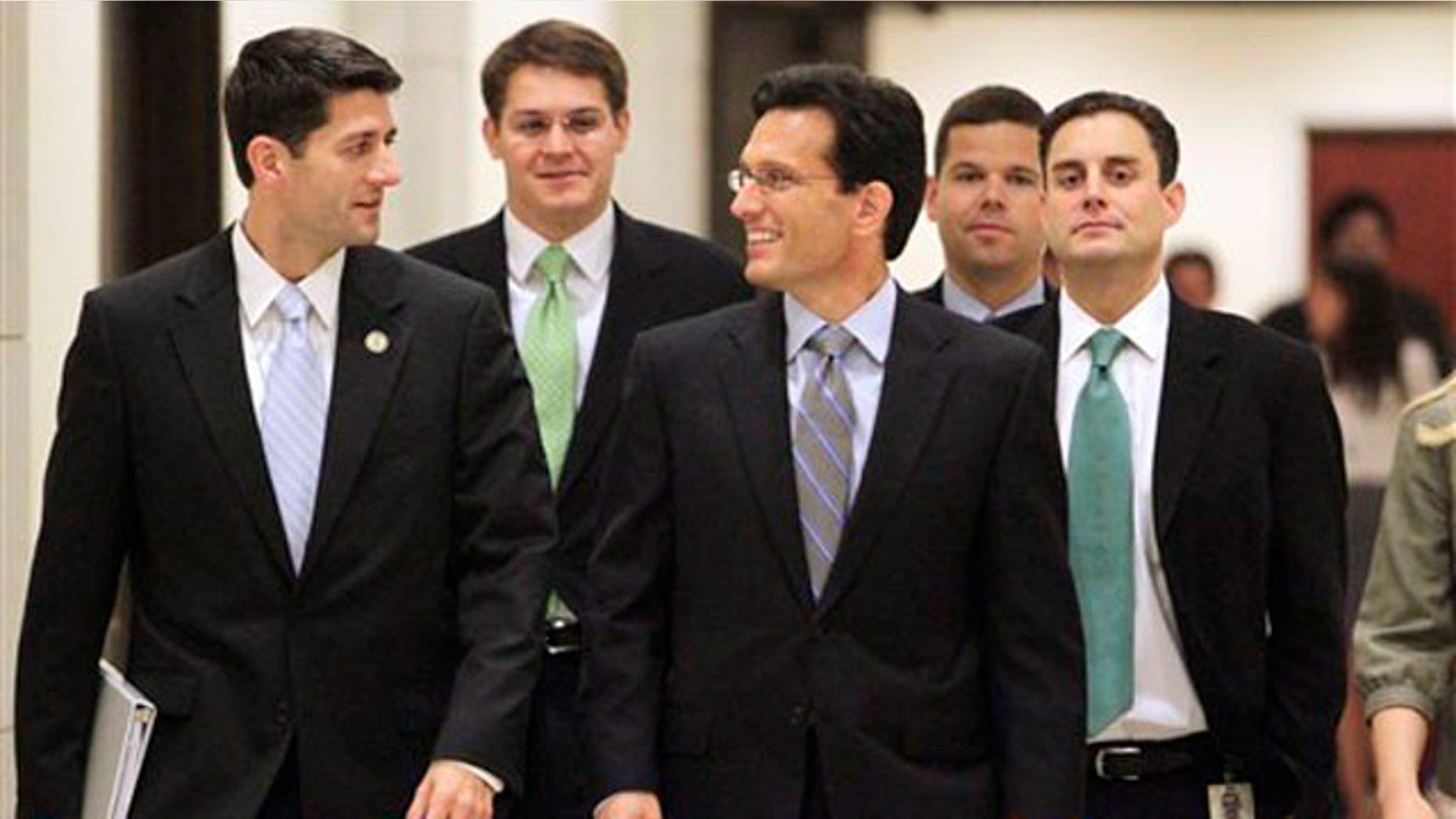 House Budget Committee Chairman Paul Ryan, left, and House Majority Leader Eric Cantor, center, and others walk to a news conference on Capitol Hill in Washington Aug. 1.