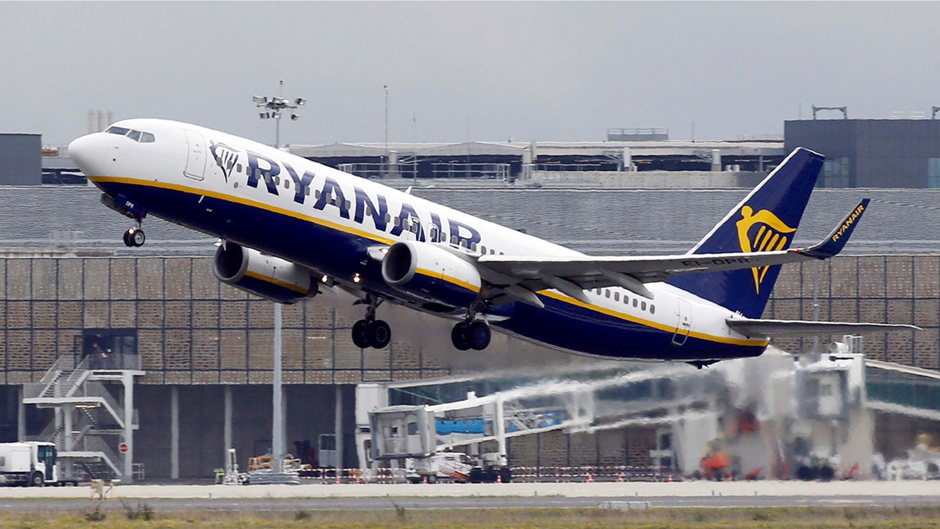 The incidents took place aboard a Ryanair flight from Riga, in Latvia, to Manchester, England. Bajalis was arrested upon arrival in Manchester.