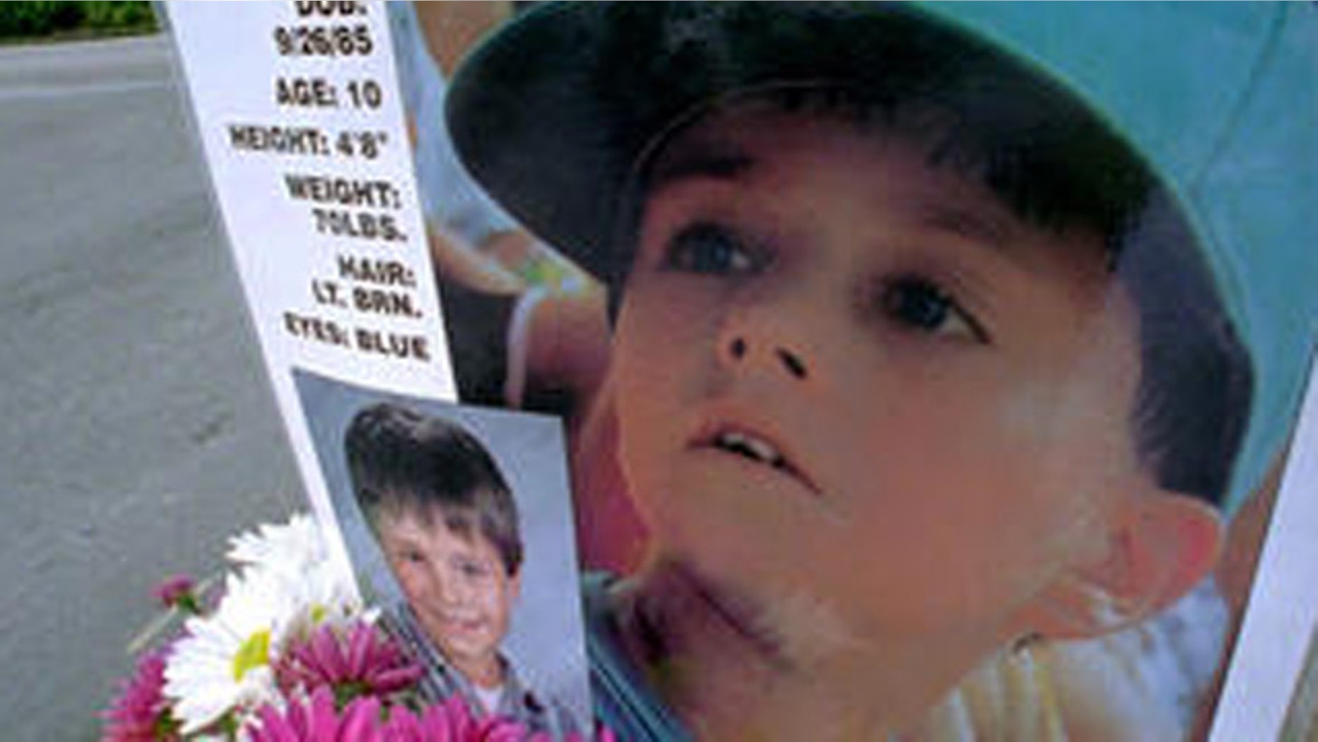 A poster of Jimmy Ryce hangs on a stop sign near the home of his parents.