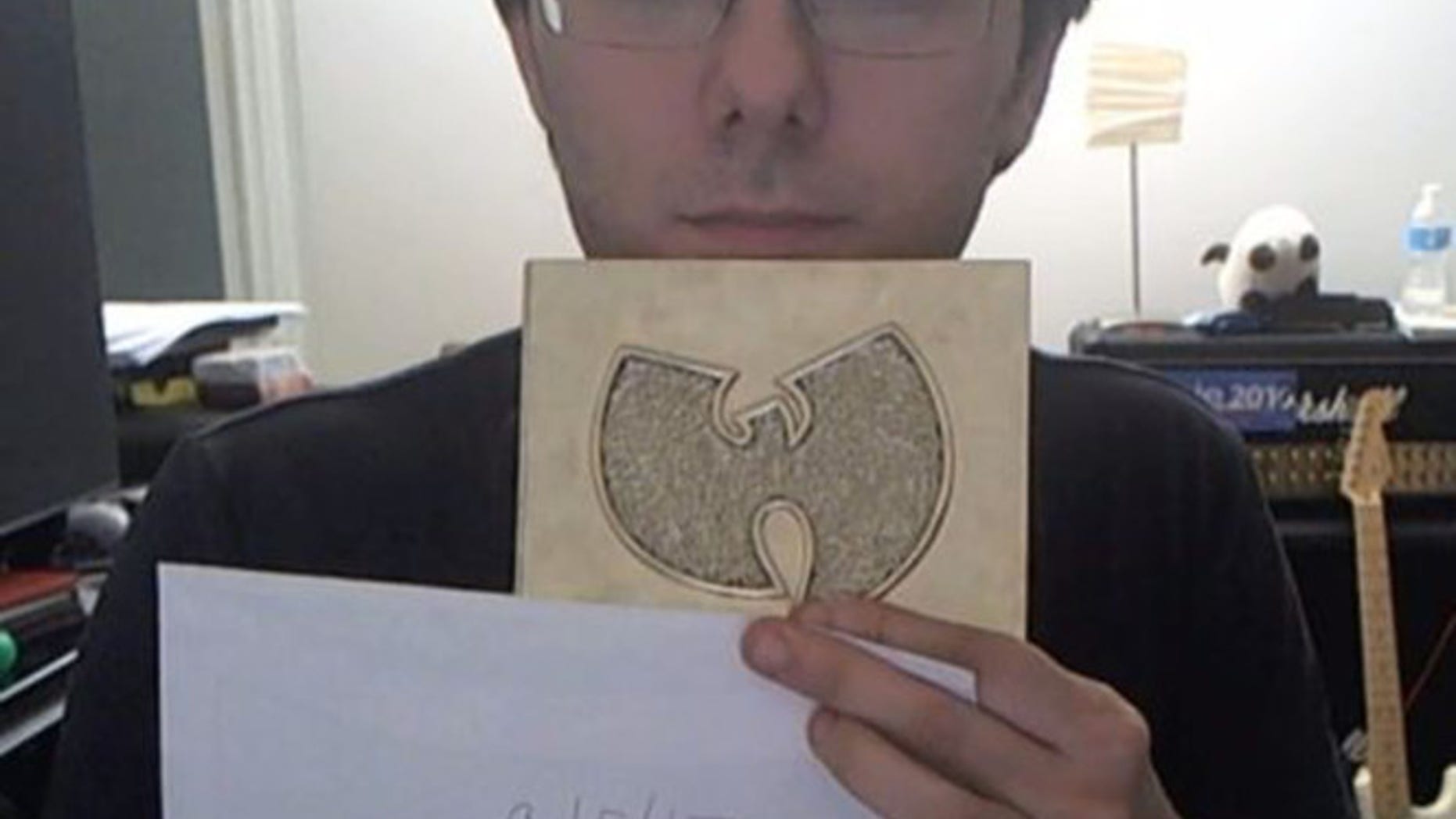 Martin Shkreli holds up his copy of the Wu-Tang Clan album 'Once Upon a Time in Shaolin'
