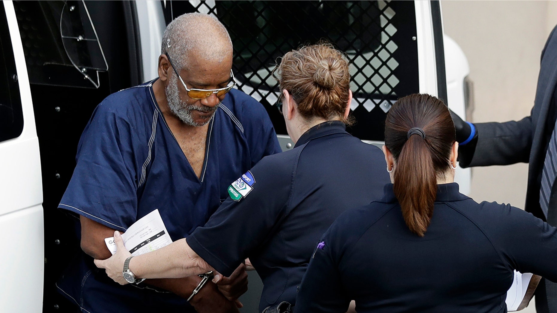 James Mathew Bradley Jr., 60, of Clearwater, Florida, left, arrives at the federal courthouse for a hearing, Monday, July 24, 2017, in San Antonio.