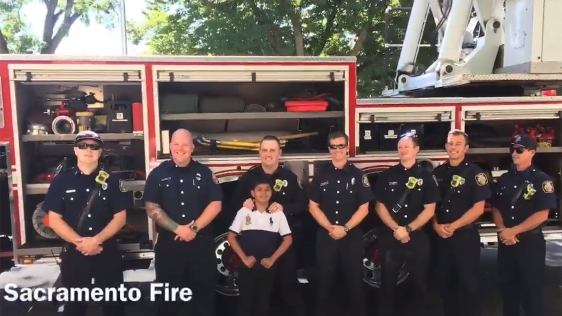 Saul Orejel, pictured with members of the Sacramento Fire Department, has dreamed of becoming a firefighter since he was a little boy.