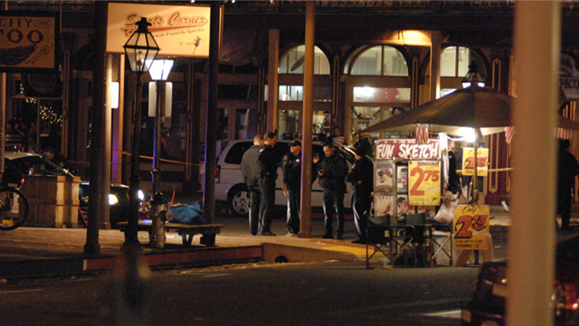 Dec. 31, 2012: In this image provided by Robert Petersen police inspect the scene of a shooting outside the Sports Corner Cafe in Sacramento Calif. (AP)