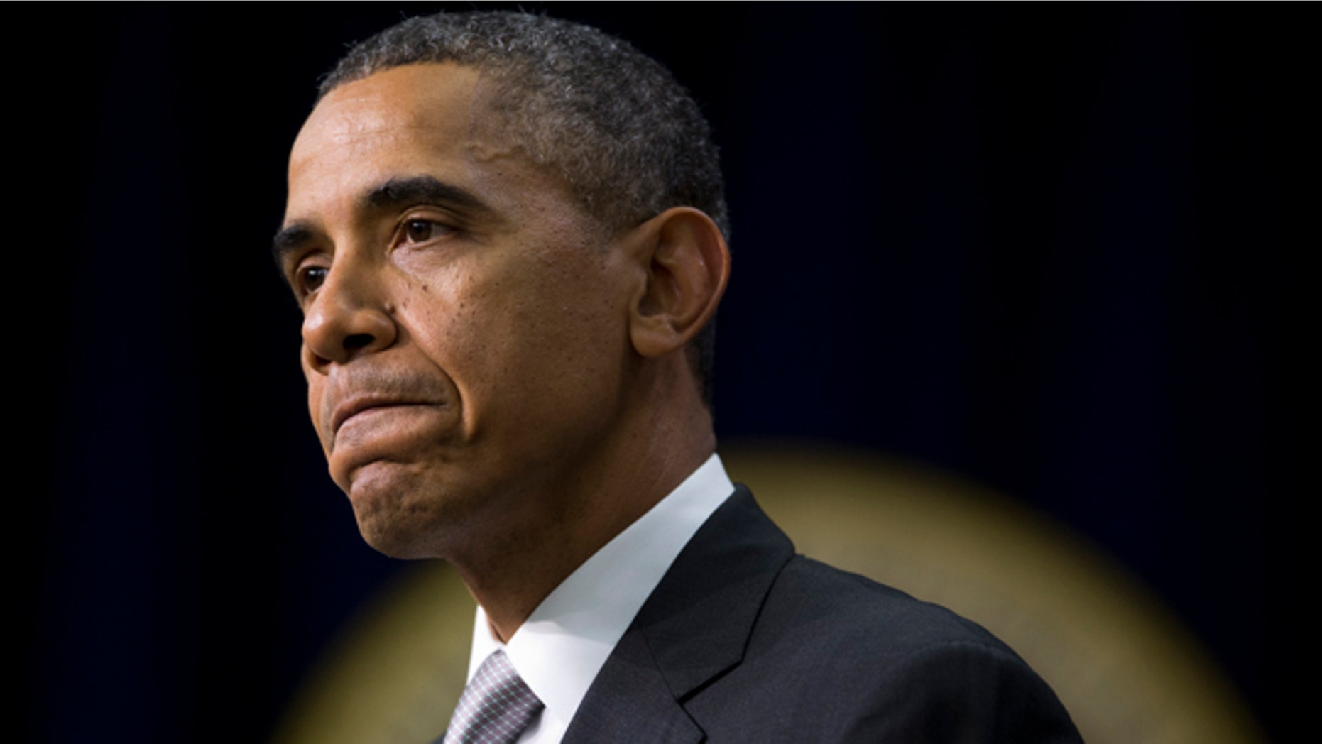 Dec. 3, 2013: President Obama pauses as he speaks about the new health care law in the South Court Auditorium in the Eisenhower Executive Office Building on the White House complex in Washington.