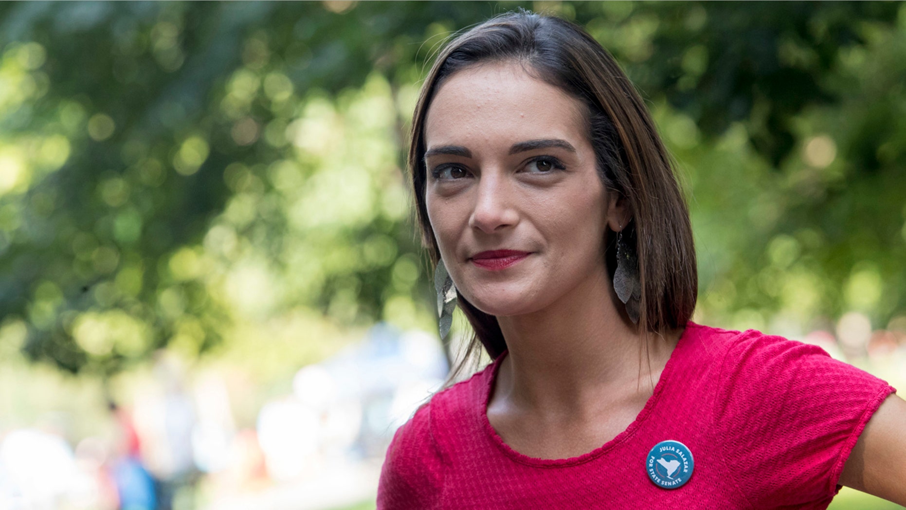 In this Aug. 15, 2018 file photo, Democratic New York state Senate candidate Julia Salazar smiles as she speaks to a supporter before a rally in McCarren Park in Brooklyn. Salazer said Sep. 11 that she was sexually assaulted five years ago by David Keyes , a spokesman for Israeli Prime Minister Benjamin Netanyahu, an accusation he denies. (AP Photo/Mary Altaffer, File)