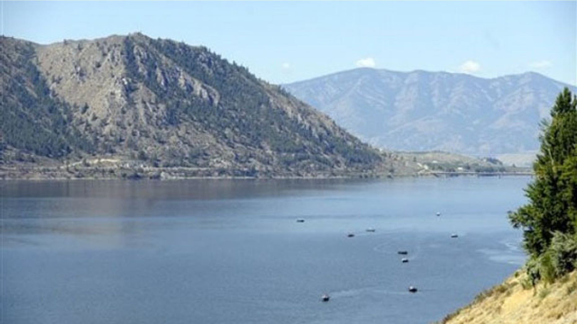 Salmon fishermen troll along the banks of a stretch of the Columbia River near Brewster, Wash. on July 22, 2010.