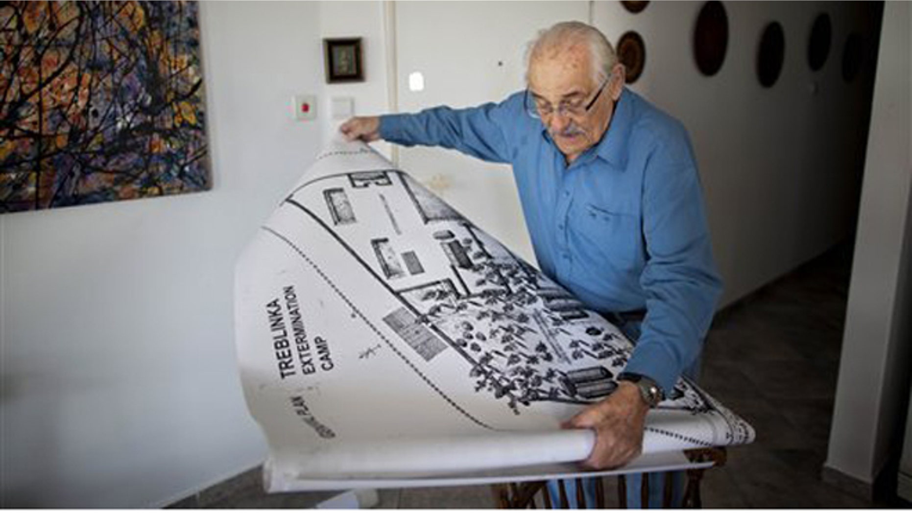 Holocaust survivor Samuel Willenberg displays a map of Treblinka extermination camp during an interview with the Associated Press at his house in Tel Aviv, Israel, Sunday, Oct. 31, 2010. (AP)