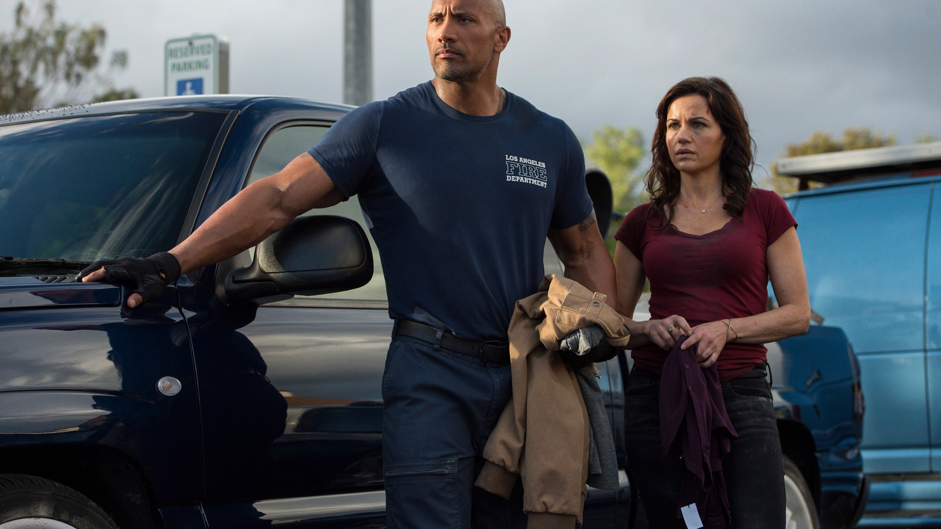 Dwayne Johnson, left, as Ray, and Carla Gugino as Emma in "San Andreas."