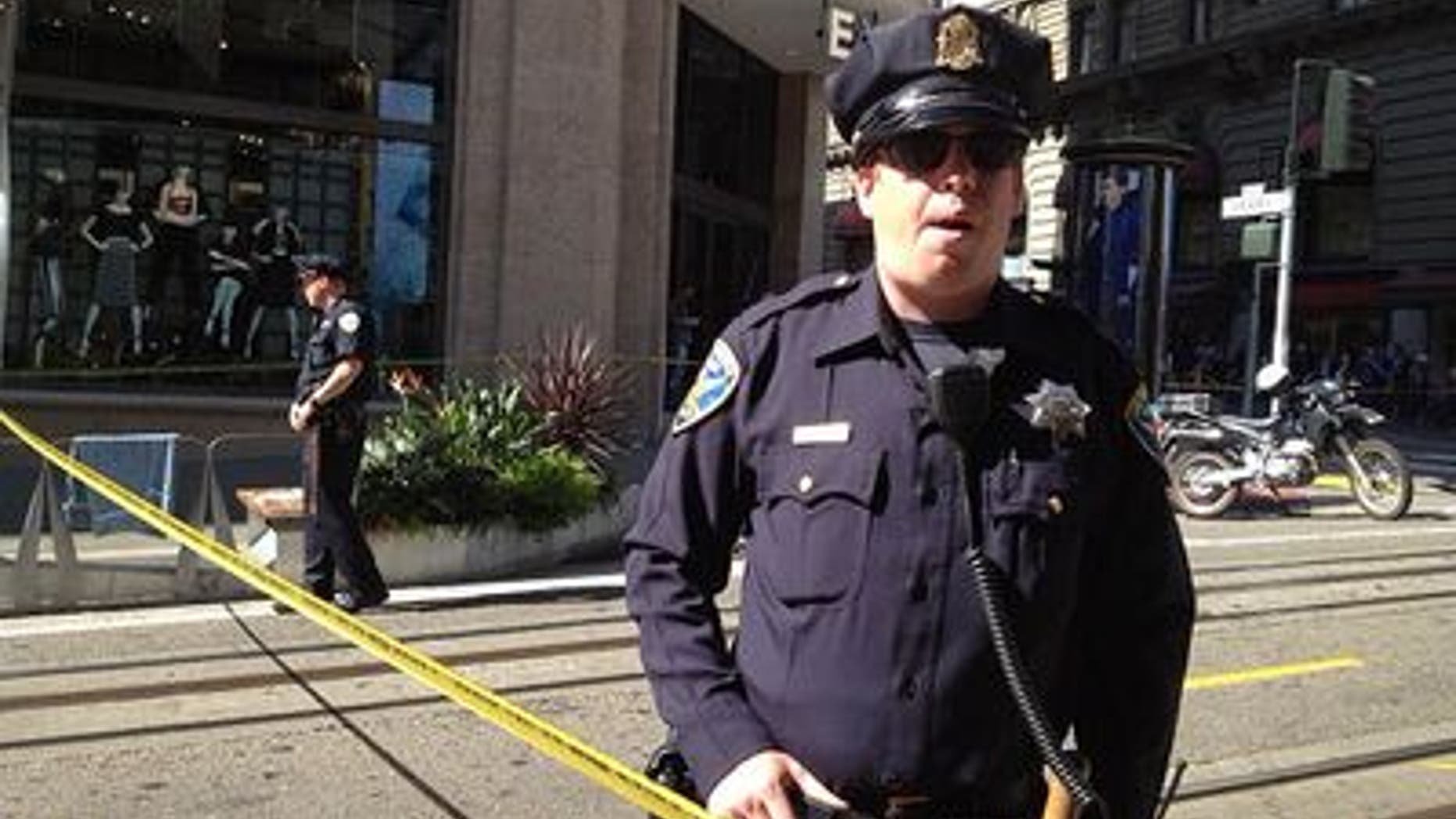 Oct. 17, 2013: A San Francisco police officer patrols an area near Union Square after a bomb square temporarily led to the evacuation of part of the city's downtown.