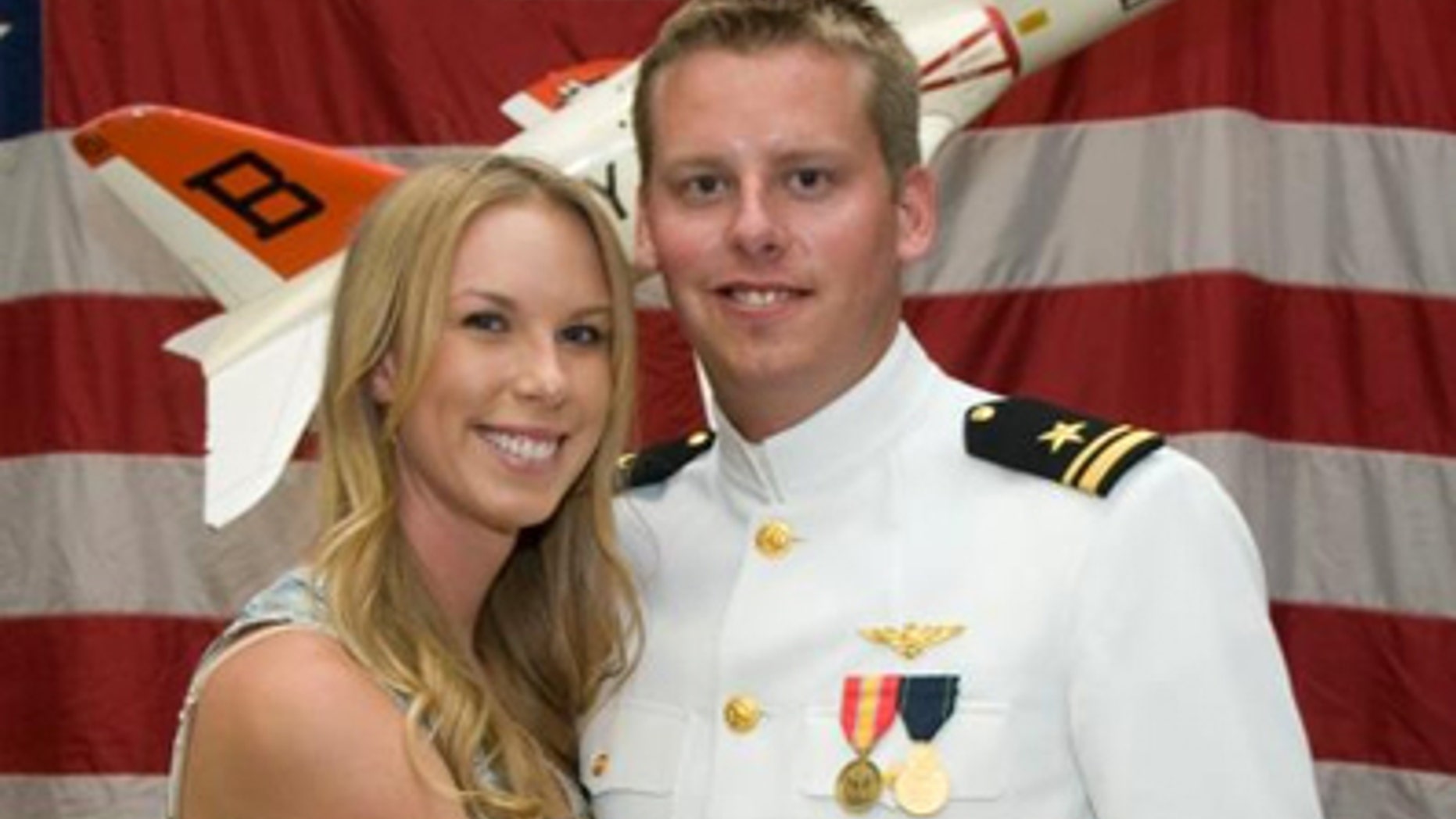 January 2, 2011: This photo provided by the Reis family shows Karen Reis, left, and her brother David Reis at his winging ceremony for the Navy.