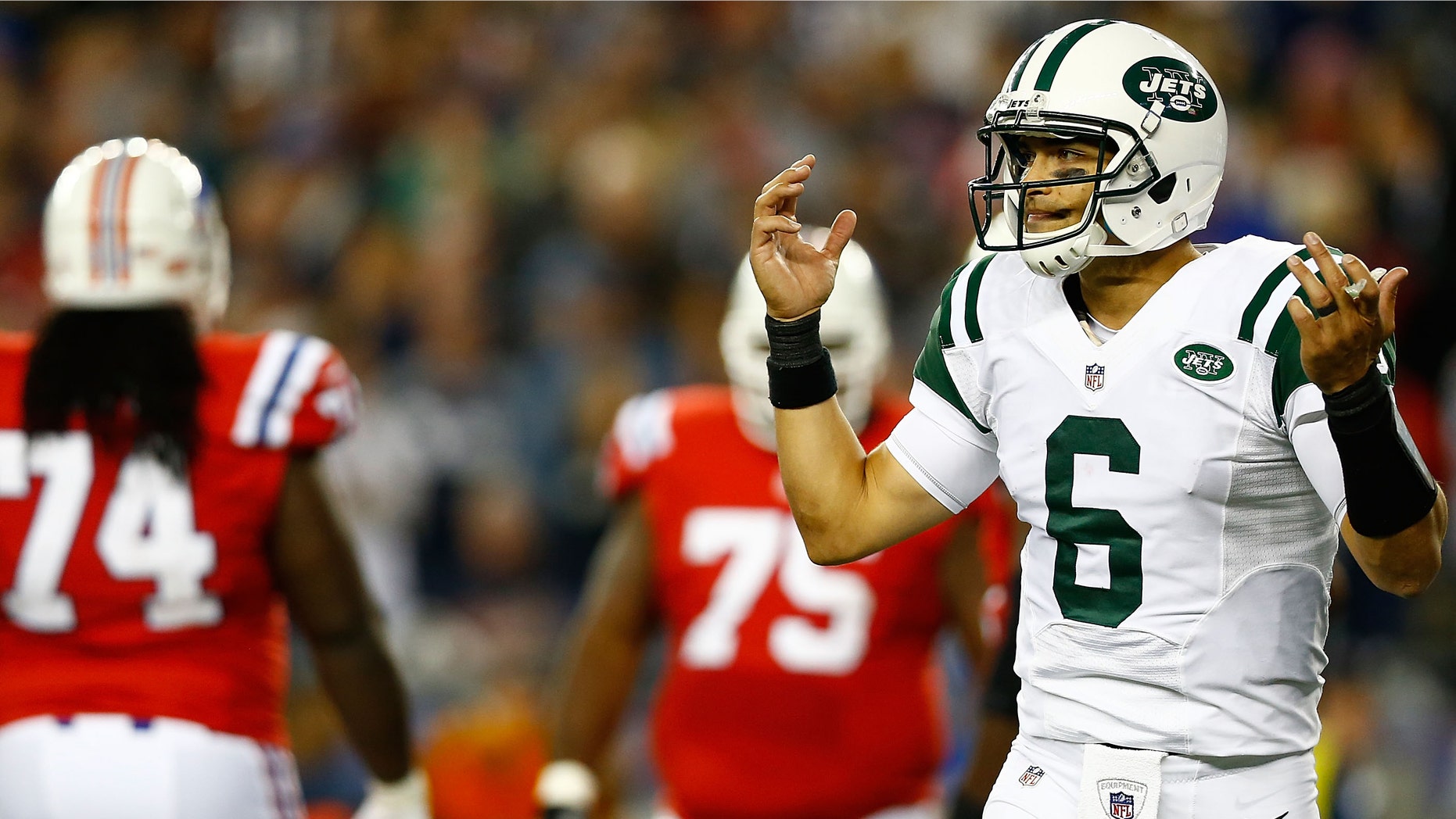 FOXBORO, MA - OCTOBER 21: With the boisterous crowd, Mark Sanchez #6 of the New York Jets signals to the sideline for the play against the New England Patriots during the game on October 21, 2012 at Gillette Stadium in Foxboro, Massachusetts. (Photo by Jared Wickerham/Getty Images)