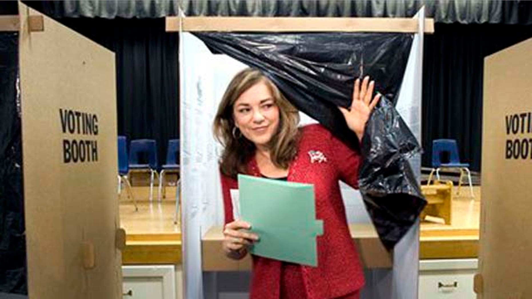 Democratic Congresswoman Loretta Sanchez emerges from a voting booth after casting her ballot at Santiago Elementary School in Santa Ana, Calif. on Tuesday, Nov. 2, 2010. (AP Photo/The Orange County Register, H. Lorren Au Jr. )