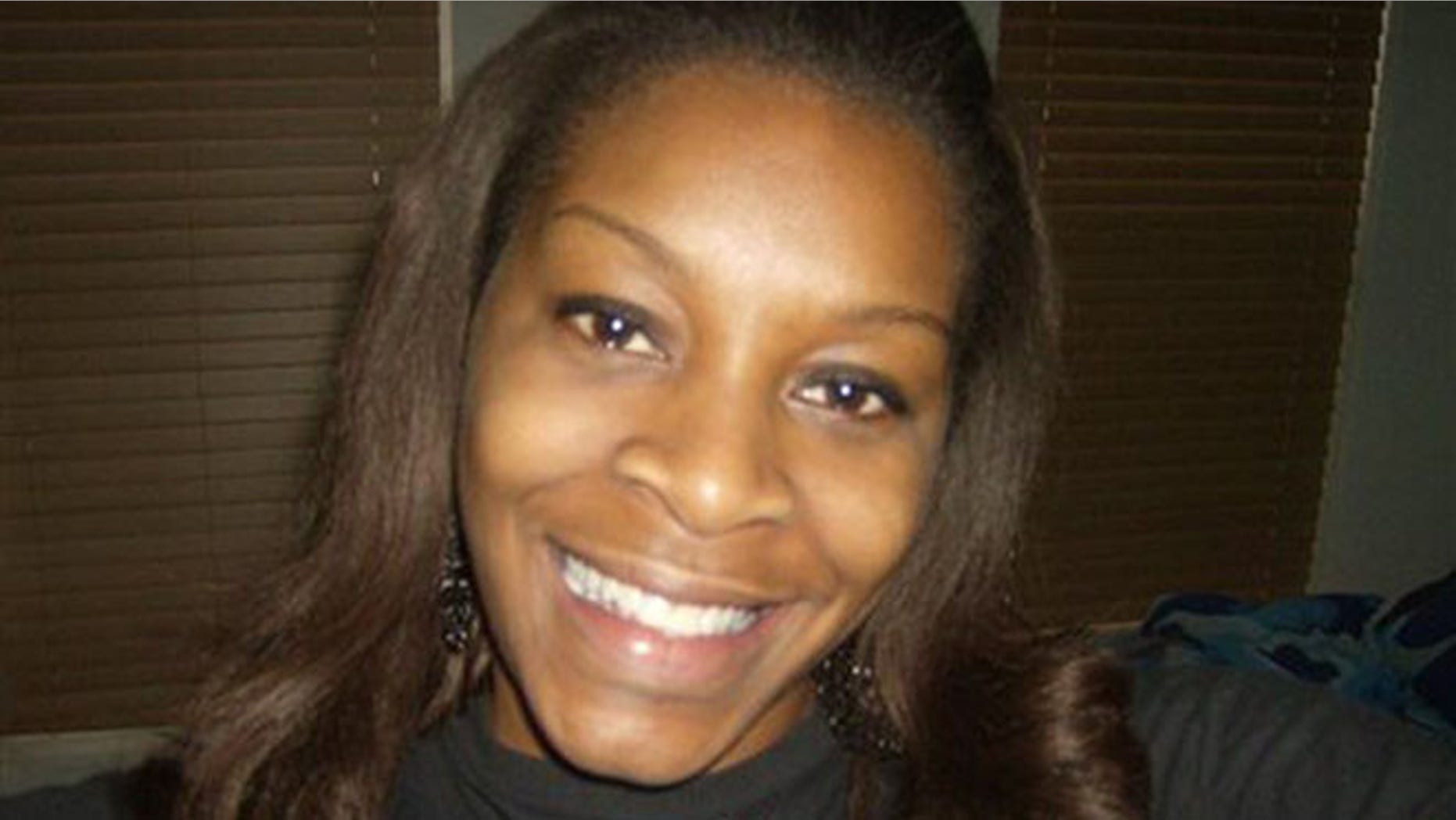 In this undated photo provided by the Bland family, Sandra Bland poses for a photo.