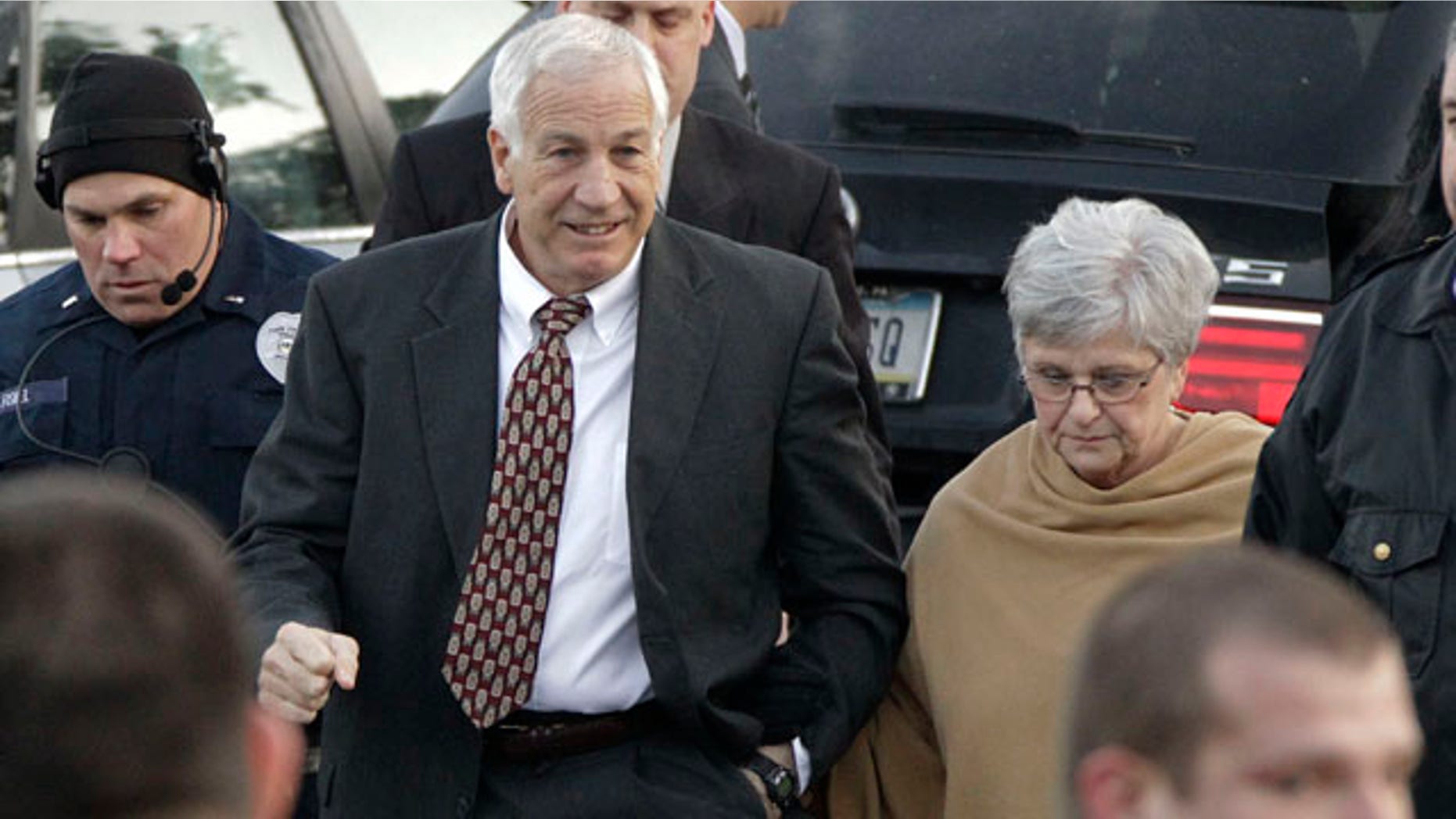 Dec. 13, 2011: Jerry Sandusky, left, the former Penn State assistant football coach charged with sexually abusing boys, arrives with his wife, Dottie Sandusky, for a preliminary hearing at the Centre County Courthouse in Bellefonte, Pa., where he will face his accusers.