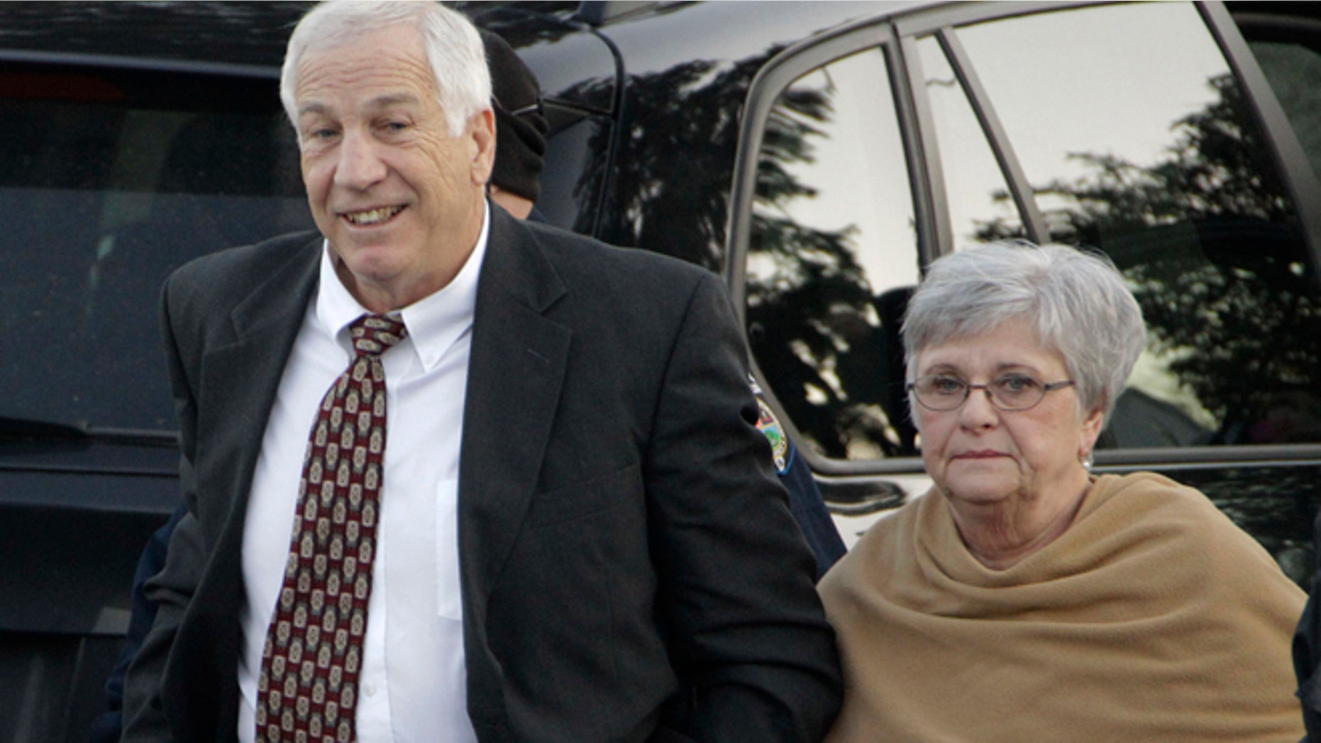 Dec. 13, 2011: In this file photo, former Penn State assistant football coach Jerry Sandusky arrives with his wife, Dottie Sandusky, for a preliminary hearing at the Centre County Courthouse in Bellefonte, Pa.