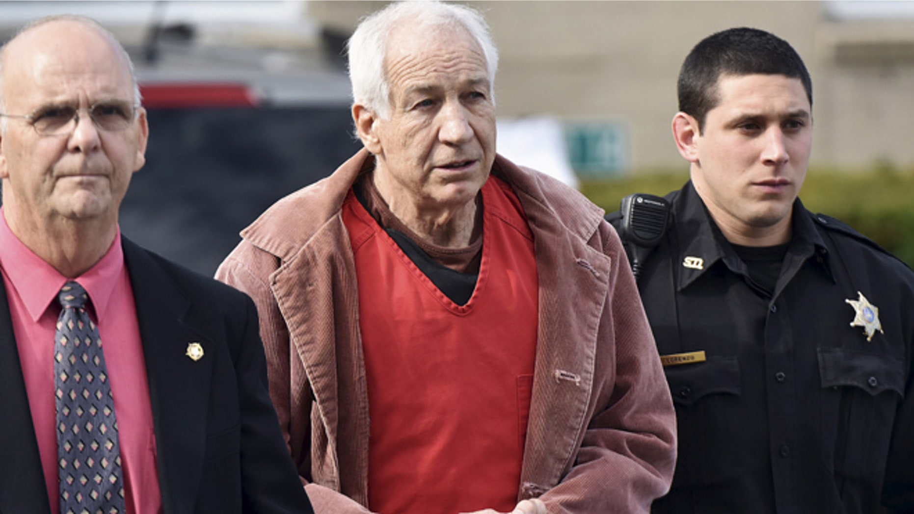 Oct. 19, 2015: Convicted child molester Jerry Sandusky (C), a former assistant football coach at Penn State University, leaves after his appeal hearing at the Centre County Courthouse in Bellefonte, Pennsylvania. (Reuters)