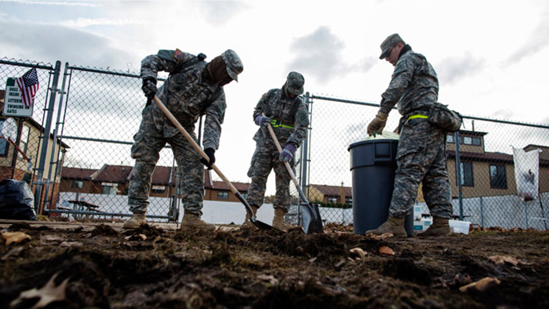 Nov. 15, 2012: National Guard troops work to clean sidewalks of storm debris from Hurricane Sandy in the Staten Island borough neighborhood of New Dorp Beach in New York.