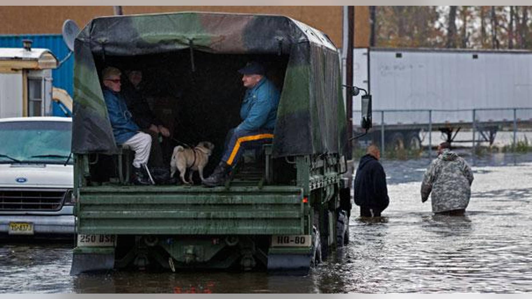 Military trucks, such as this one used earlier this week to rescue residents of a flooded Moonachie, NJ, well be sent to storm-ravaged areas of the Garden State on Election Day to be used as a make-shift polling station.