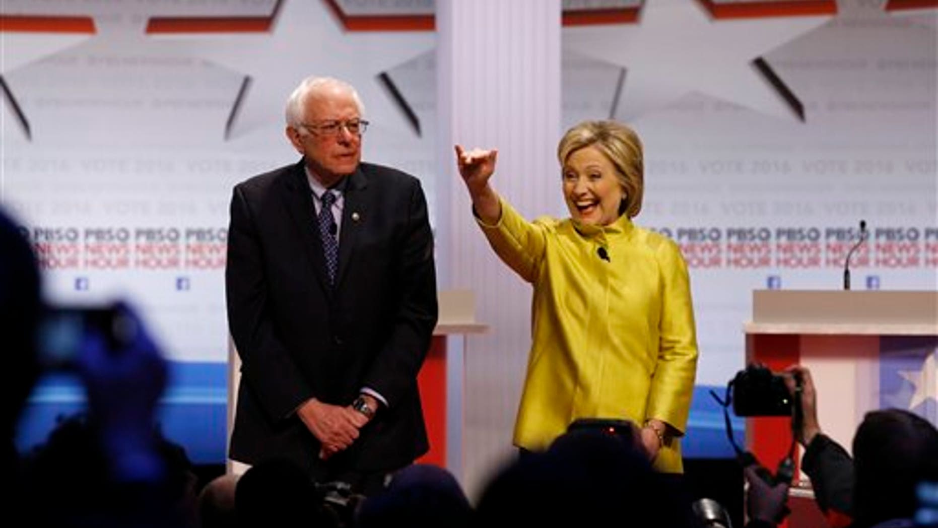 Democratic presidential candidates Sen. Bernie Sanders, I-Vt., and Hillary Clinton take the stage before a primary debate at the University of Wisconsin-Milwaukee, Feb. 11, 2016, in Milwaukee. (AP Photo/Tom Lynn)