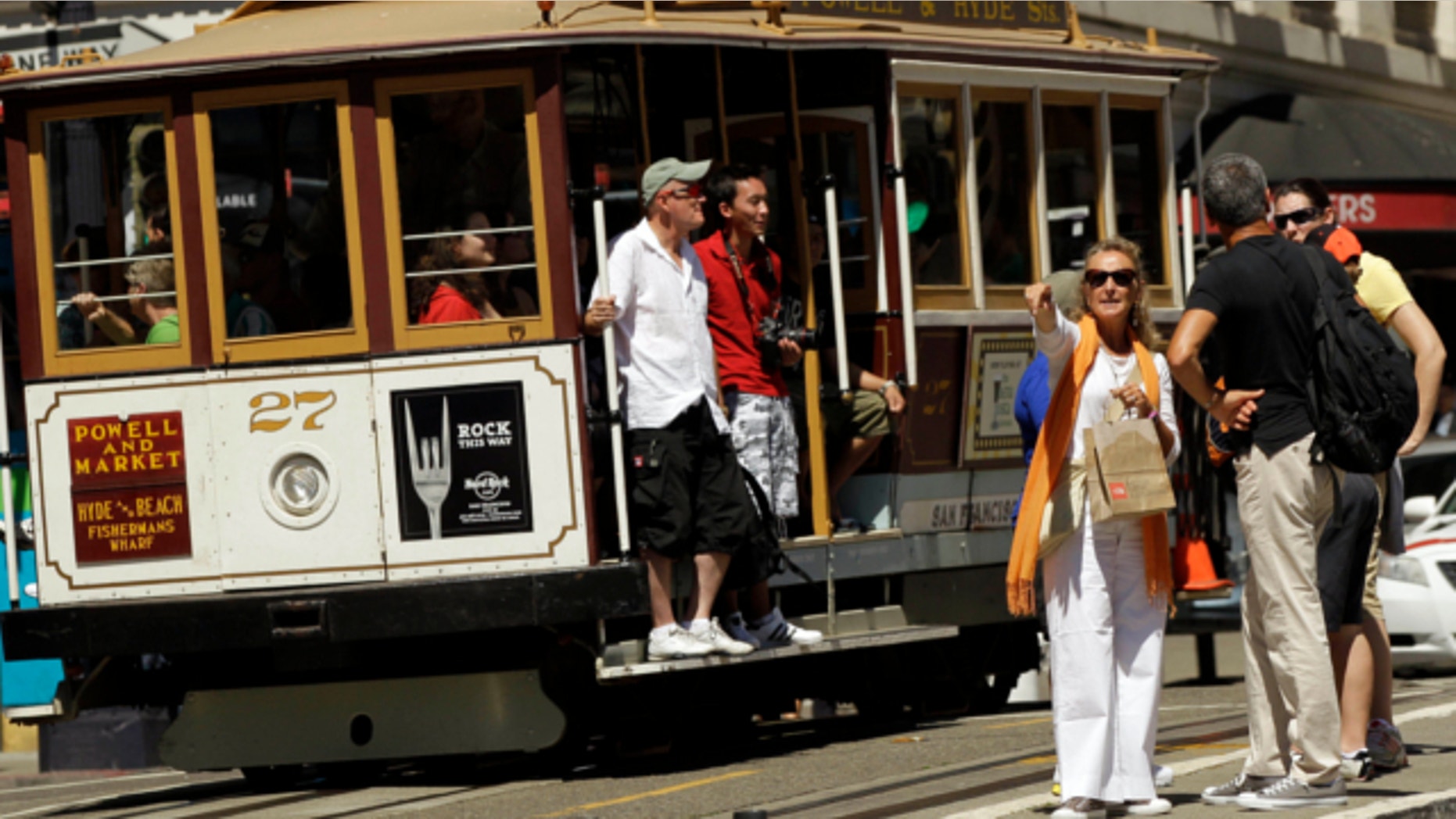 Sept. 1, 2010: Visitors wait to board a cable car in San Francisco's Union Square.