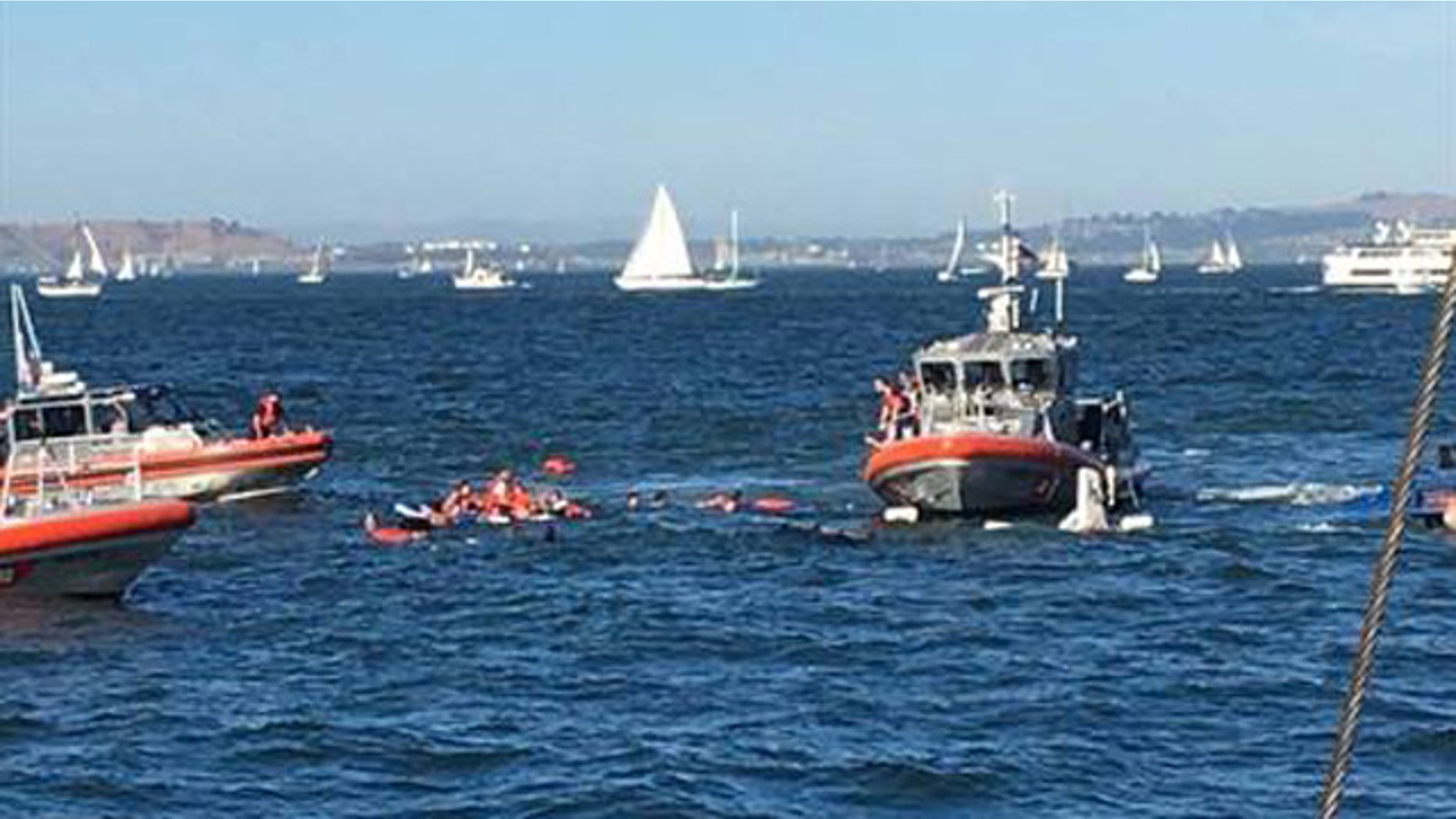 Oct. 8, 2016: Rescue boats approach passengers on a boat the capsized in San Francisco Bay Saturday. All 30 passengers were accounted for Saturday night