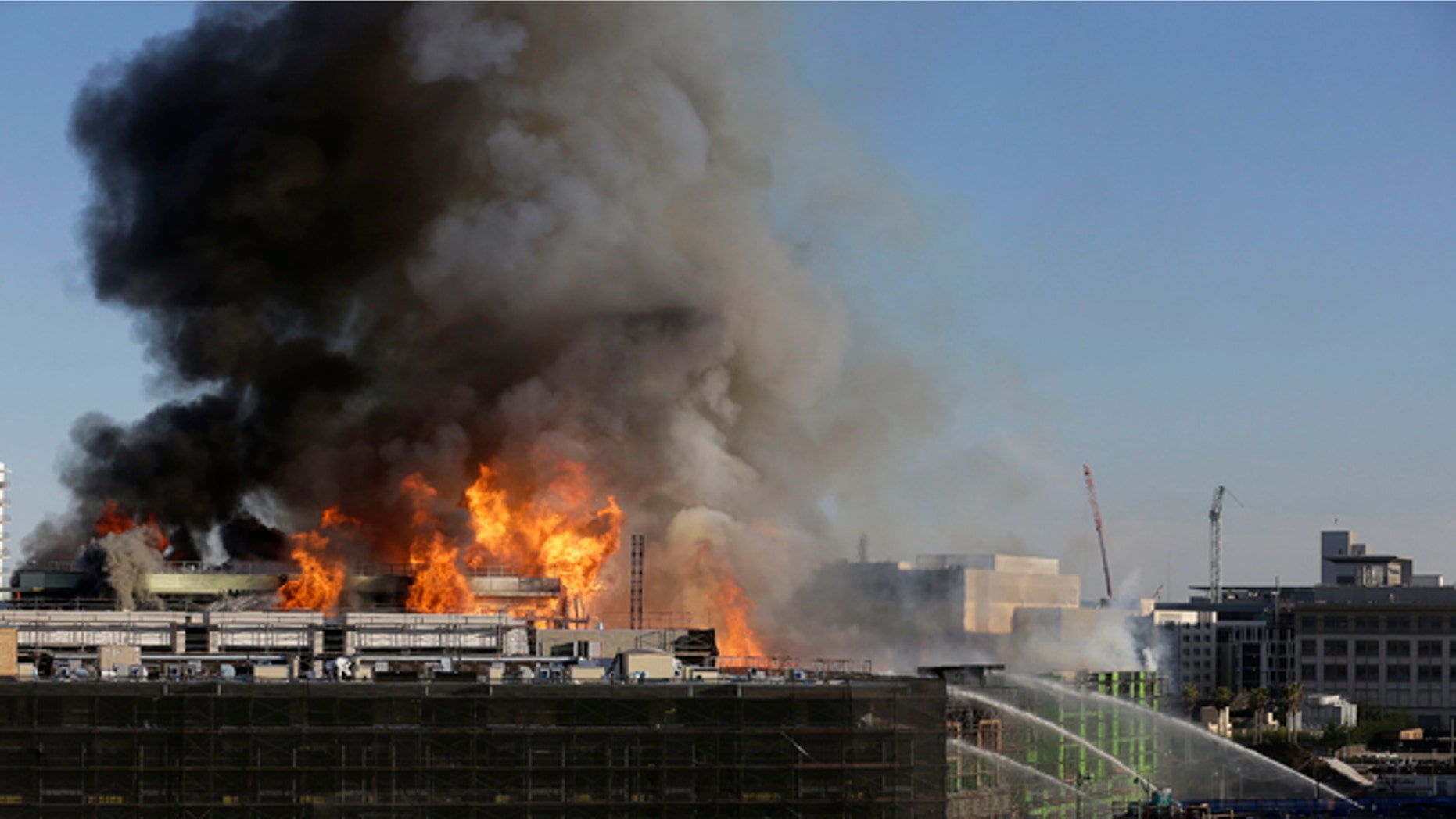 Mar. 11, 2014: Smoke rises from a fire burning in San Francisco.