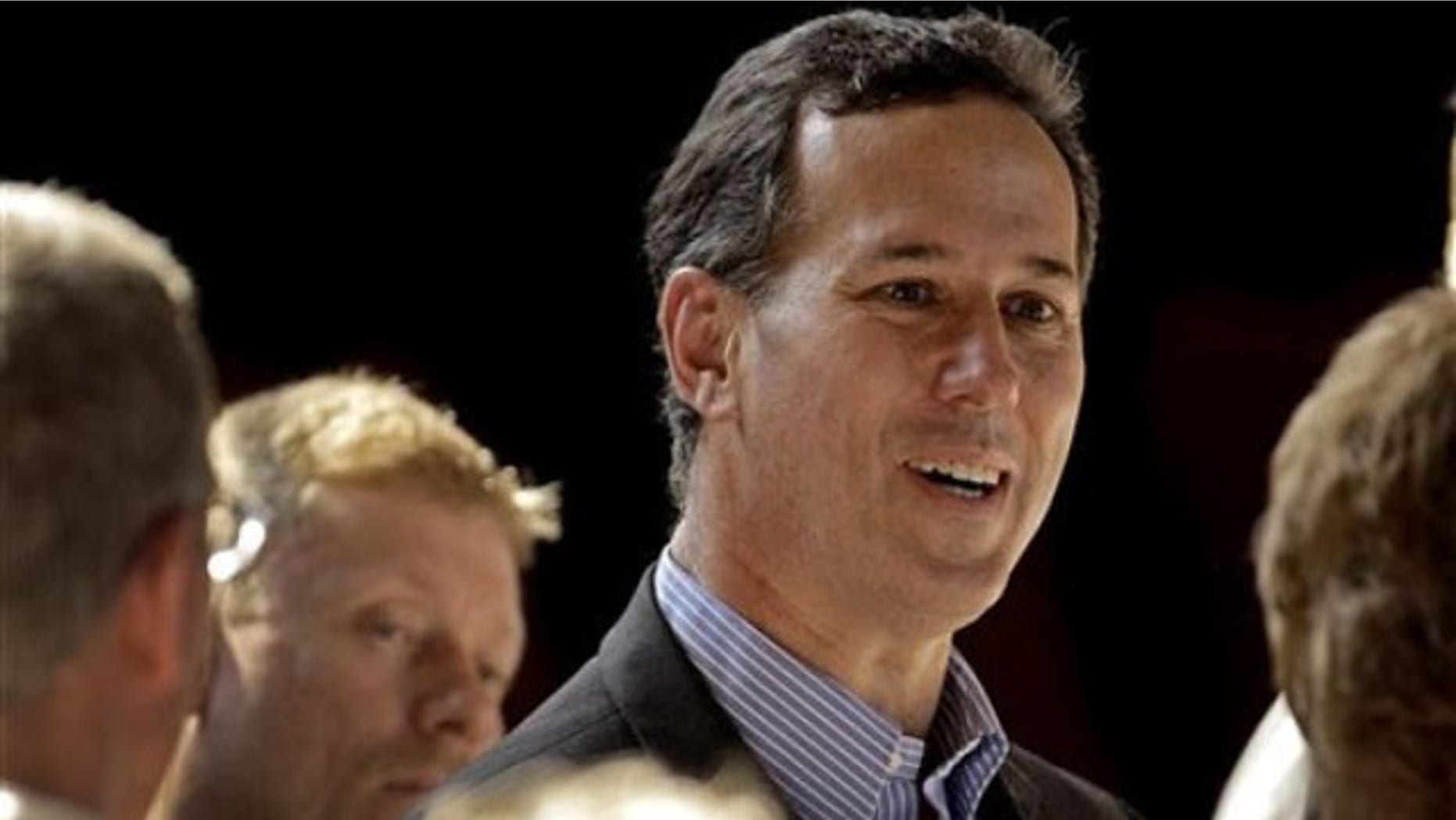 March 9, 2012: Rick Santorum greets supporters during a rally in Topeka, Kan.
