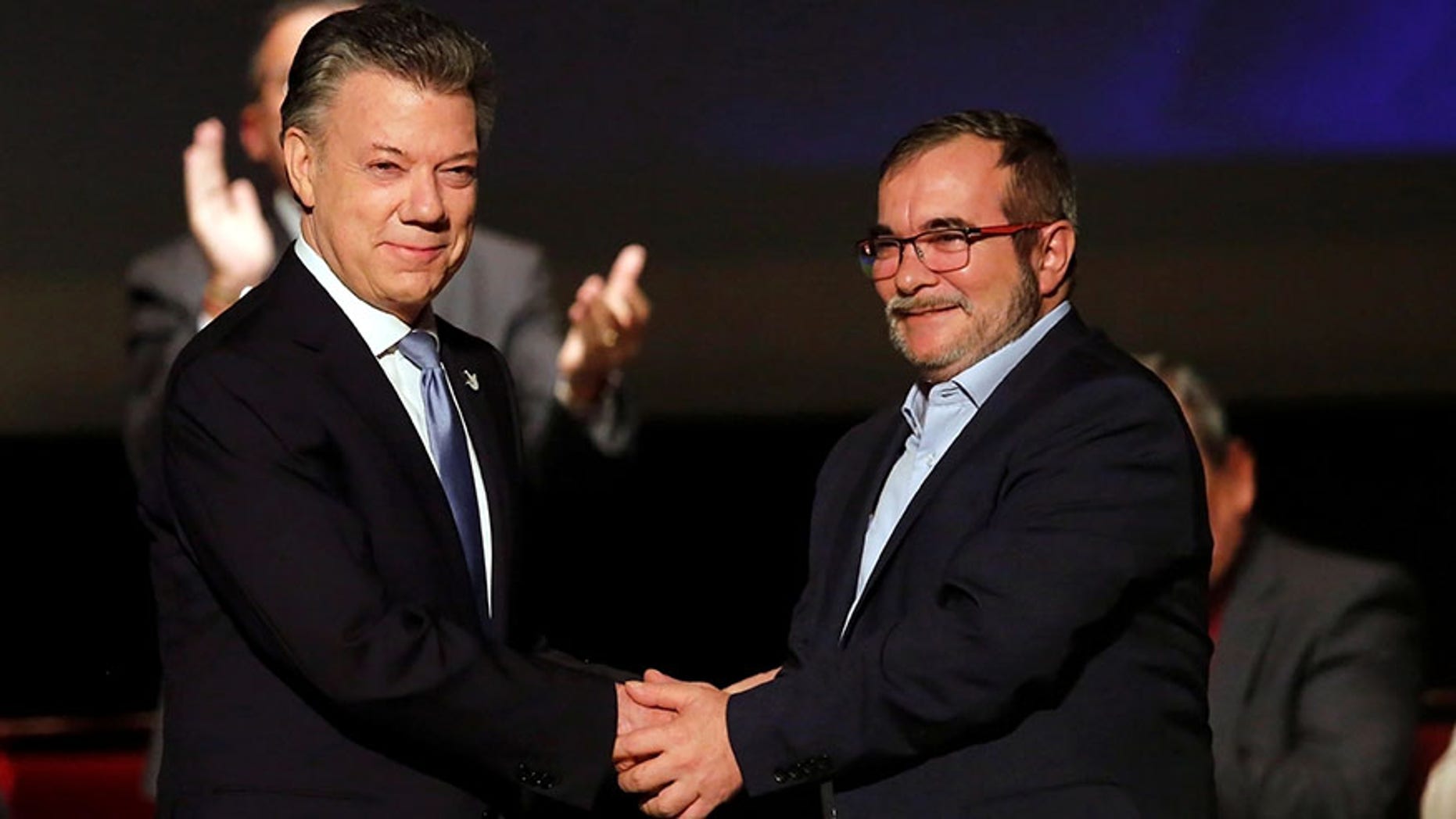 Colombia's President Juan Manuel Santos and Marxist FARC rebel leader Rodrigo Londonoin Bogota, Colombia November 24, 2016.