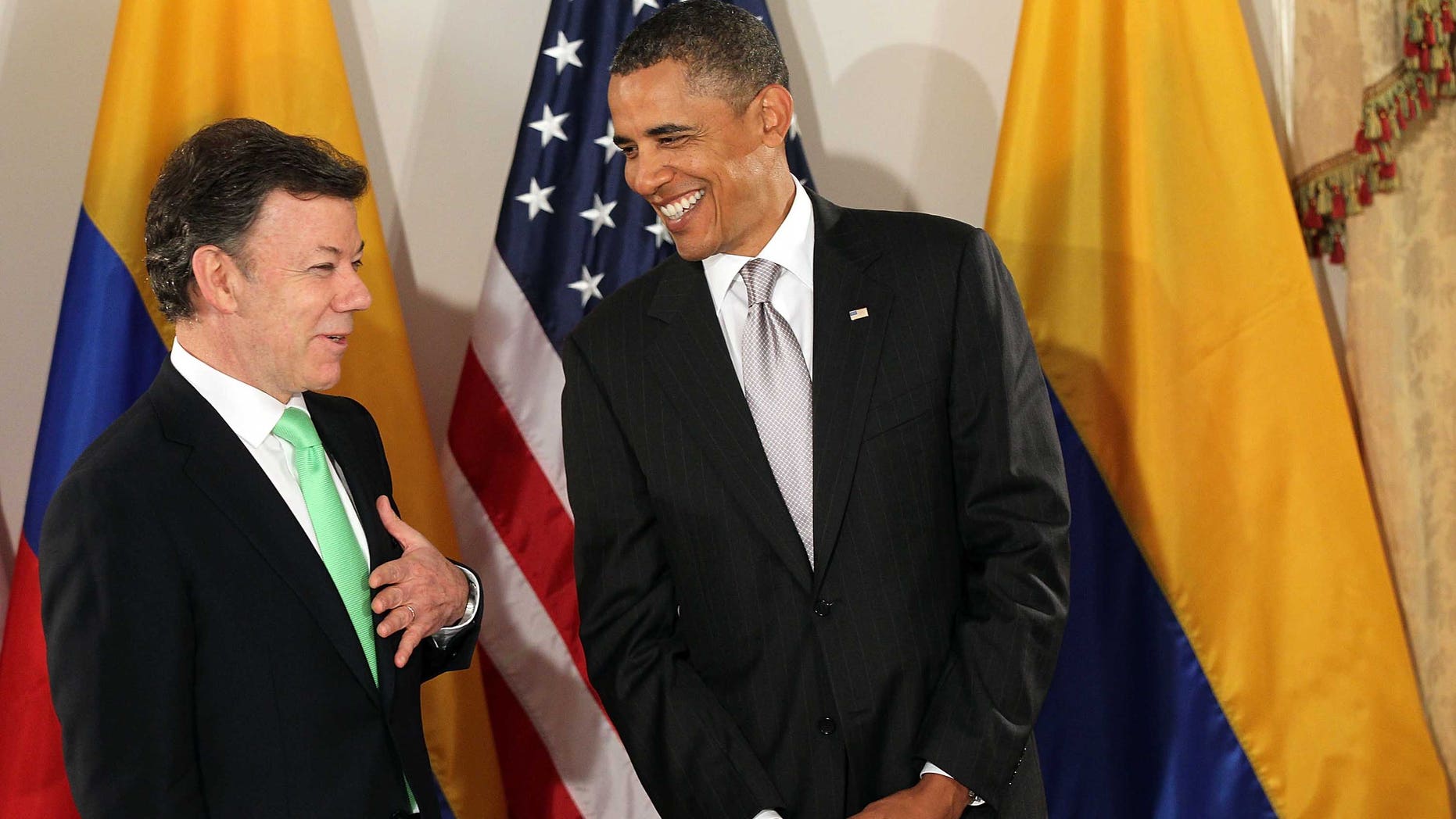NEW YORK - SEPTEMBER 24: (AFP OUT) U.S. President Barack Obama (R) enters a bilateral meeting with President Juan Manuel Santos Calderon of Colombia September 24, 2010 in New York City. Obama has been in New York since Wednesday attending the annual General Assembly at the United Nations, where yesterday he stressed the need for a resolution between Israel and Palestine, and a renewed international effort to keep Iran from attaining nuclear weapons. (Photo by Spencer Platt/Getty Images)