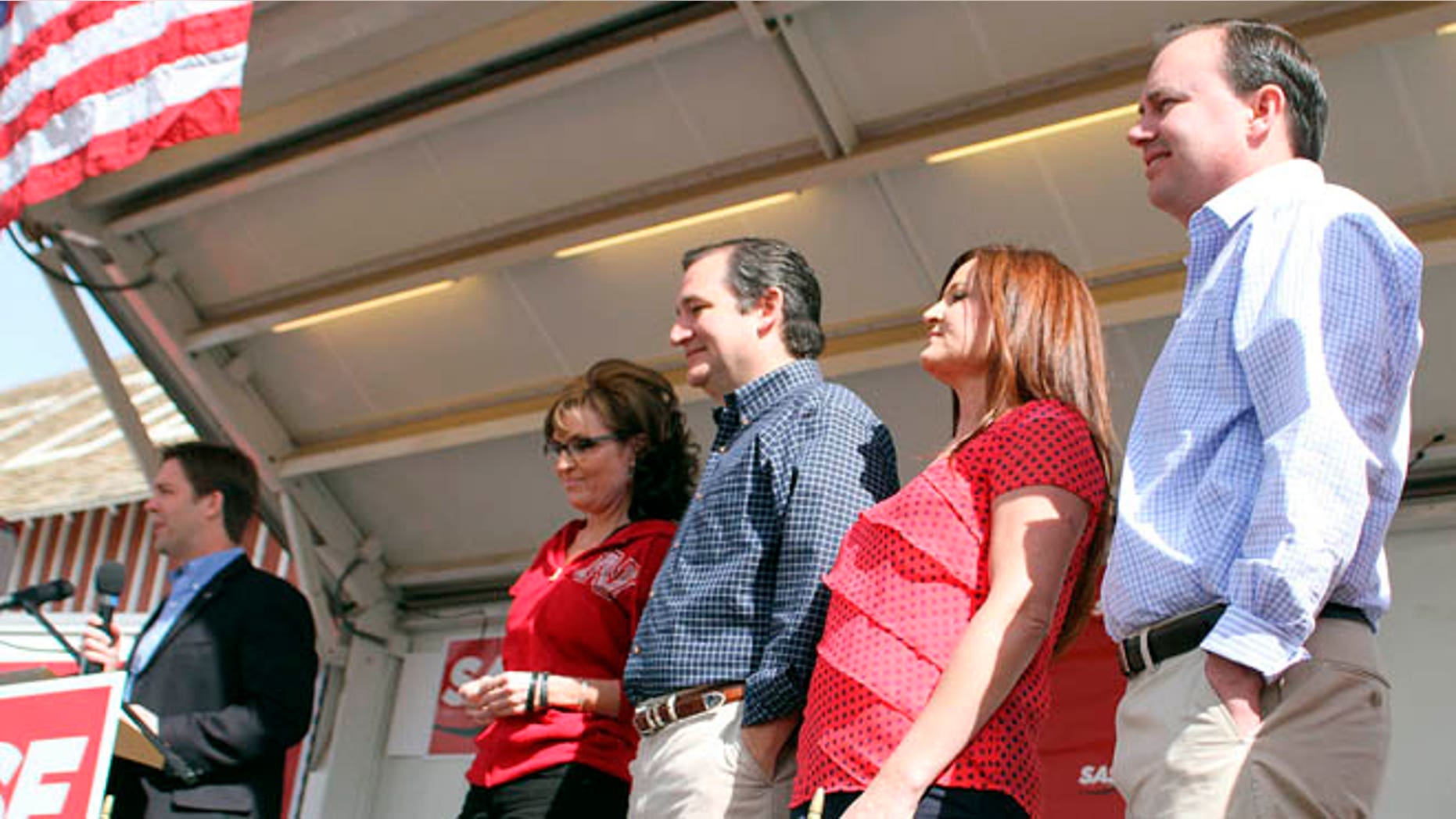 April 25, 2014: Republican Senate candidate Ben Sasse, left; former Alaska Gov. Sarah Palin; Texas Sen. Ted Cruz; Sharon Lee; Utah Sen. Mike Lee, stand together on the platform in North Platte, Neb., at a rally for Sasse.