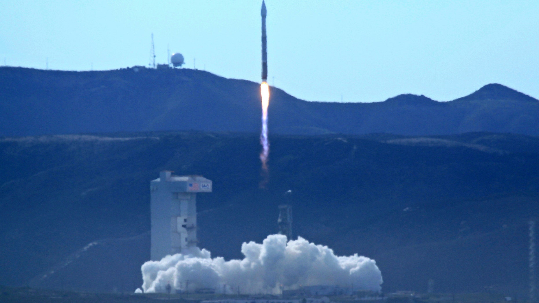 An Atlas 5 rocket carrying the WorldView-4 satellite is launched at the Vandenberg Air Force Base, Calif., on Friday, Nov. 11, 2016. The satellite is designed to produce high-resolution images of Earth from space. (Matt Hartman via AP)