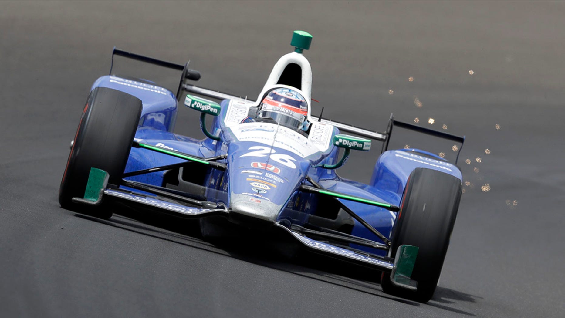Takuma Sato, of Japan, drives through the first turn during the running of the Indianapolis 500 auto race at Indianapolis Motor Speedway, Sunday, May 28, 2017, in Indianapolis. (AP Photo/Darron Cummings)