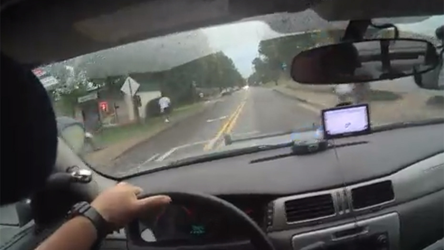 Image from bodycam video showing Athens-Clarke County Police Officer Taylor Saulters in pursuit of a suspect Friday in east Athens.