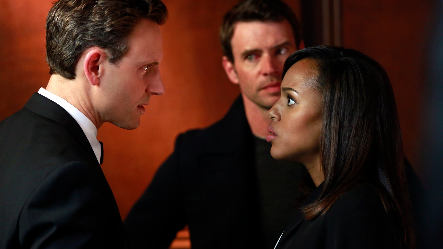 This image released by ABC shows Tony Goldwyn, from left, Scott Foley and Kerry Washington in a scene from "Scandal." The popular series ended its third season Thursday, April 18, 2014.