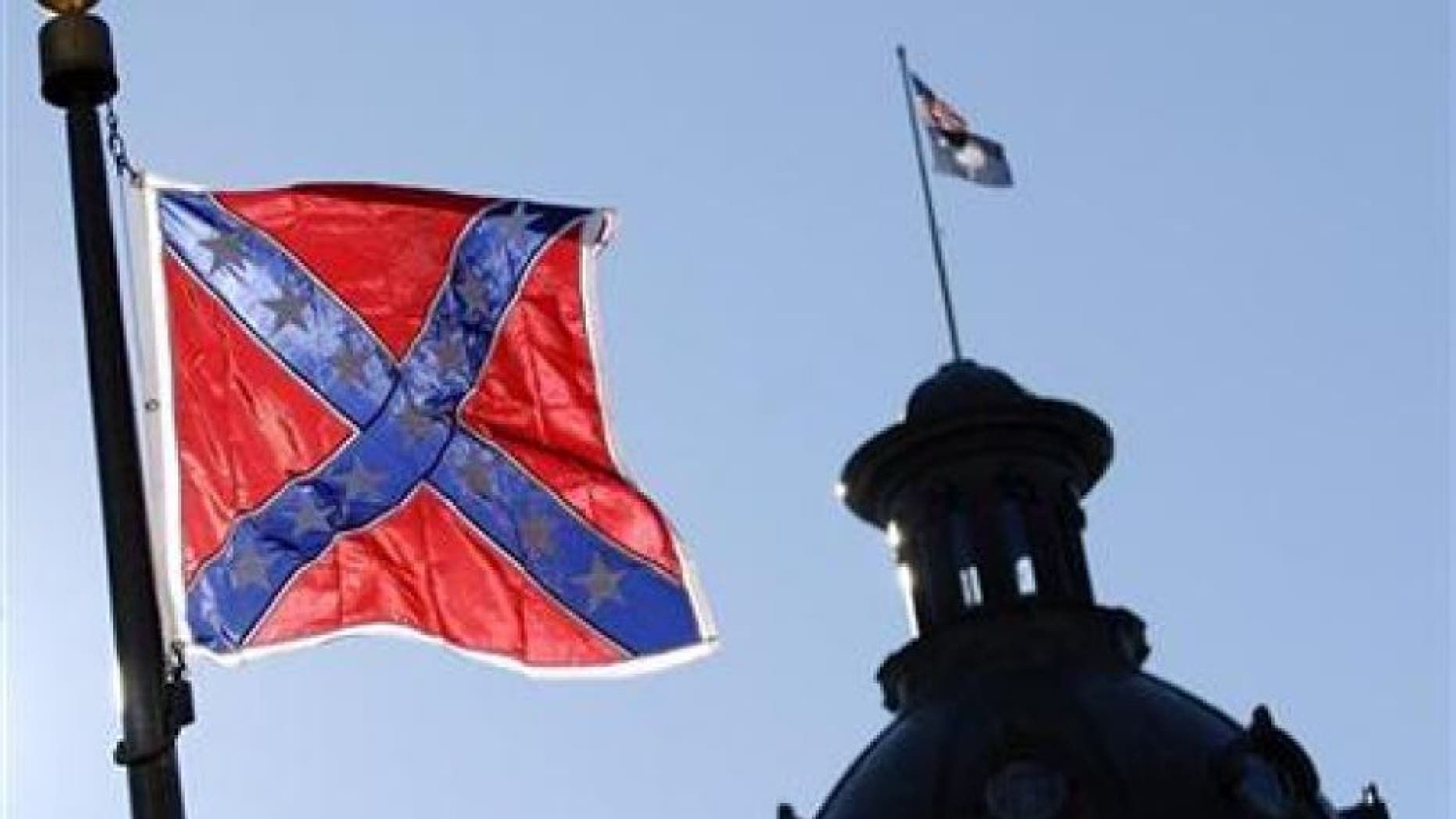 FILE: A Confederate flag flies atop the north end of the South Carolina Statehouse in Columbia