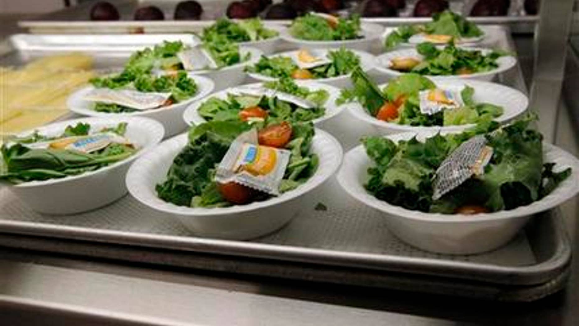 Side salads await the students of Eastside Elementary School in Clinton, Miss., Wednesday, Sept. 12, 2012. Much consideration goes into the planning of these school children's lunches. The leaner, greener school lunches served under new federal standards are getting mixed grades from students. (AP Photo/Rogelio V. Solis)