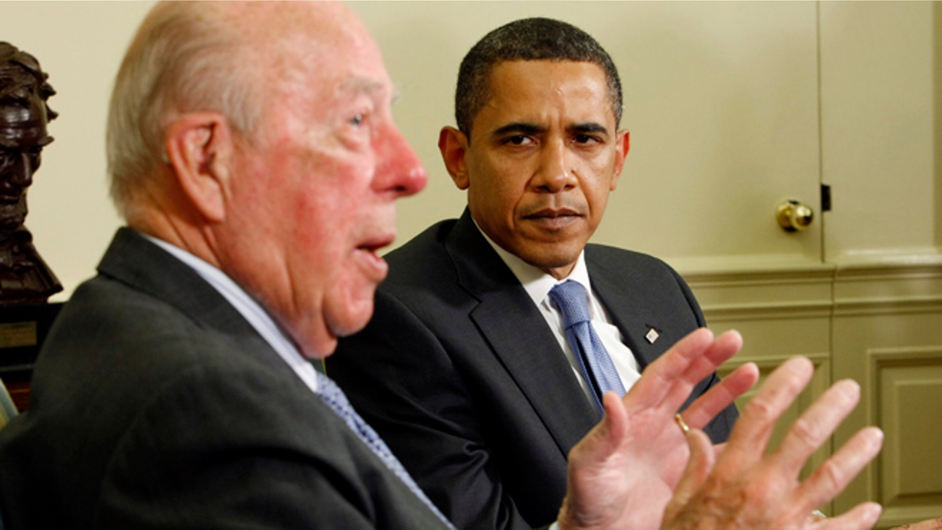 May 19, 2009: U.S. President Barack Obama listens to remarks from former U.S. Secretary of State George Schultz in the Oval Office of the White House in Washington. (Reuters)